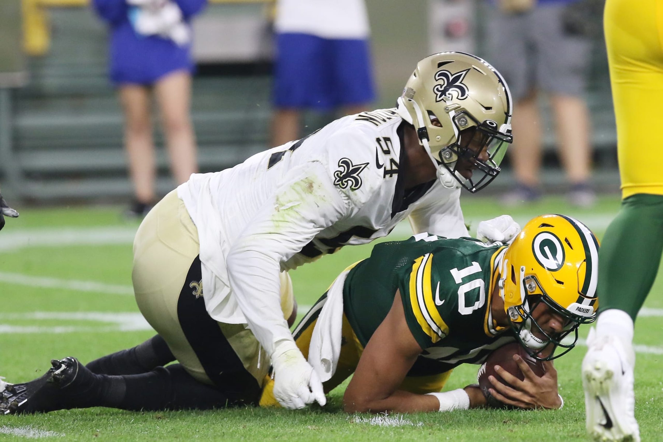 GREEN BAY, WI - AUGUST 19: New Orleans Saints defensive end Taco Charlton (54) sacks Green Bay Packers quarterback Jordan Love (10) during an NFL preseason game between the Green Bay Packers and the New Orleans Saints on August 19, 2022, at Lambeau Field in Green Bay, WI. (Photo by Larry Radloff/Icon Sportswire via Getty Images) GREEN BAY, WI - AUGUST 19: New Orleans Saints defensive end Taco Charlton (54) sacks Green Bay Packers quarterback Jordan Love (10) during an NFL preseason game between the Green Bay Packers and the New Orleans Saints on August 19, 2022, at Lambeau Field in Green Bay, WI. (Photo by Larry Radloff/Icon Sportswire via Getty Images)