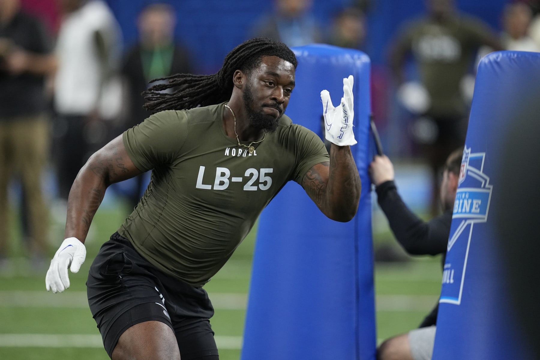 Kansas linebacker Lonnie Phelps runs a drill at the NFL football scouting combine in Indianapolis, Thursday, March 2, 2023. (AP Photo/Darron Cummings)