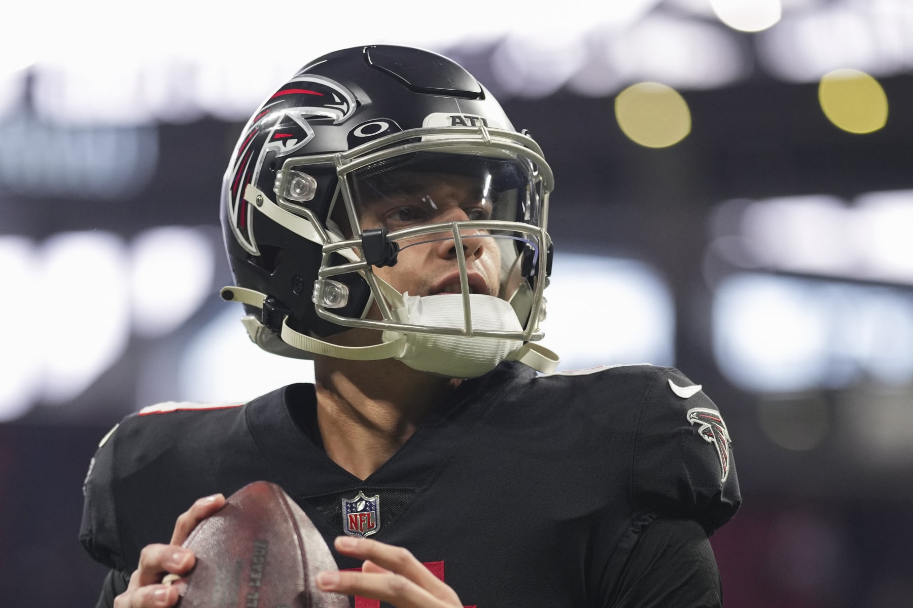 ATLANTA, GA - JANUARY 08: Desmond Ridder #4 of the Atlanta Falcons warms up against the Tampa Bay Buccaneers at Mercedes-Benz Stadium on January 8, 2023 in Atlanta, Georgia. (Photo by Cooper Neill/Getty Images)