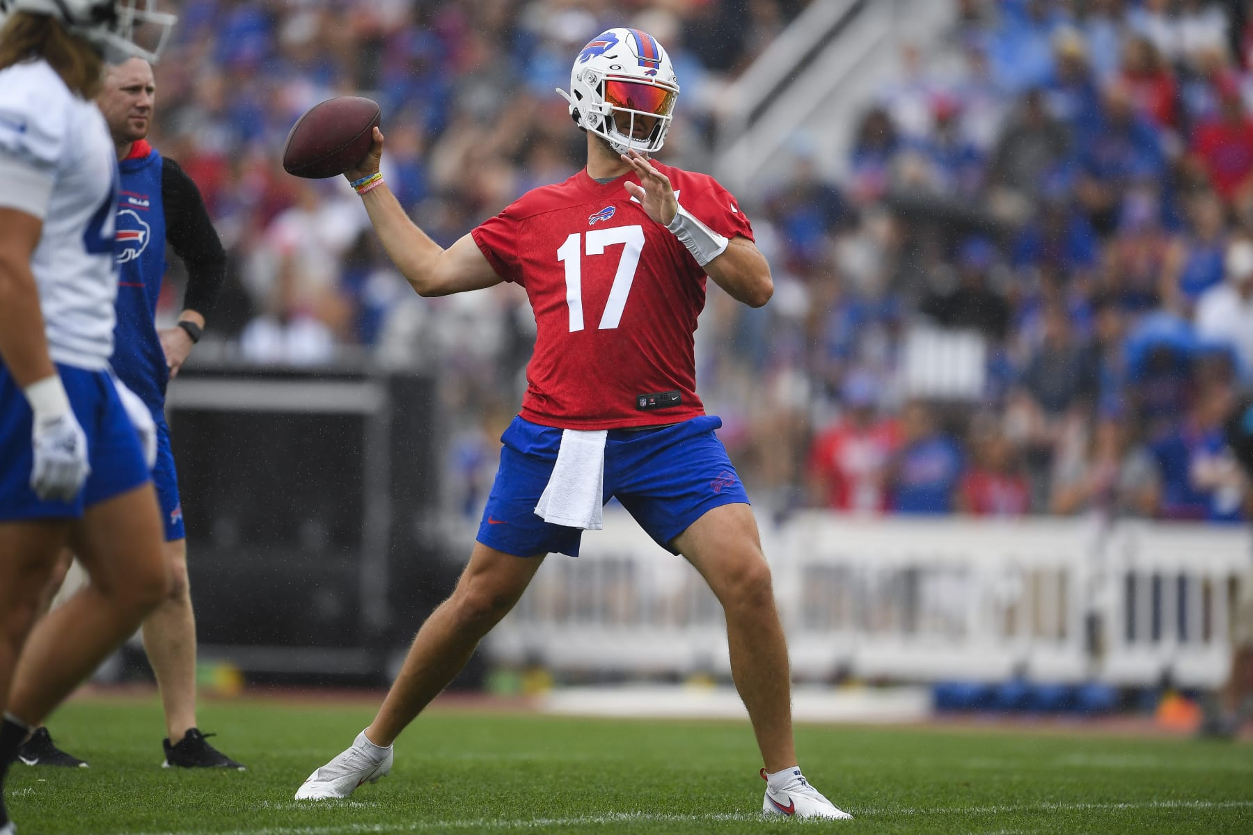 Buffalo Bills quarterback Josh Allen (17) throws a pass during practice at the NFL football team's training camp in Pittsford, N.Y., Thursday, July 27, 2023. (AP Photo/Adrian Kraus)