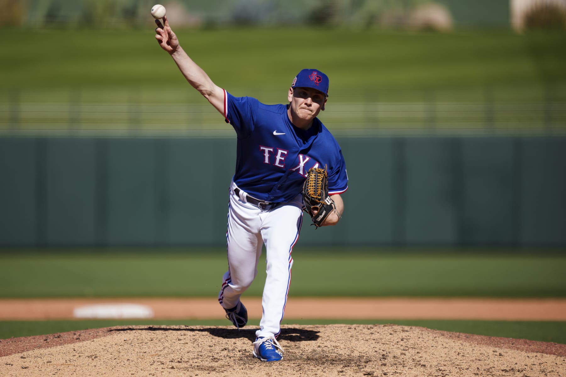 SURPRISE, AZ - FEBRUARY 25: Spencer Howard #36 of the Texas Rangers delivers a pitch during a spring training game against the Kansas City Royals at Surprise Stadium on February 25, 2023 in Surprise, Arizona. (Photo by Ben Ludeman/Texas Rangers/Getty Images)