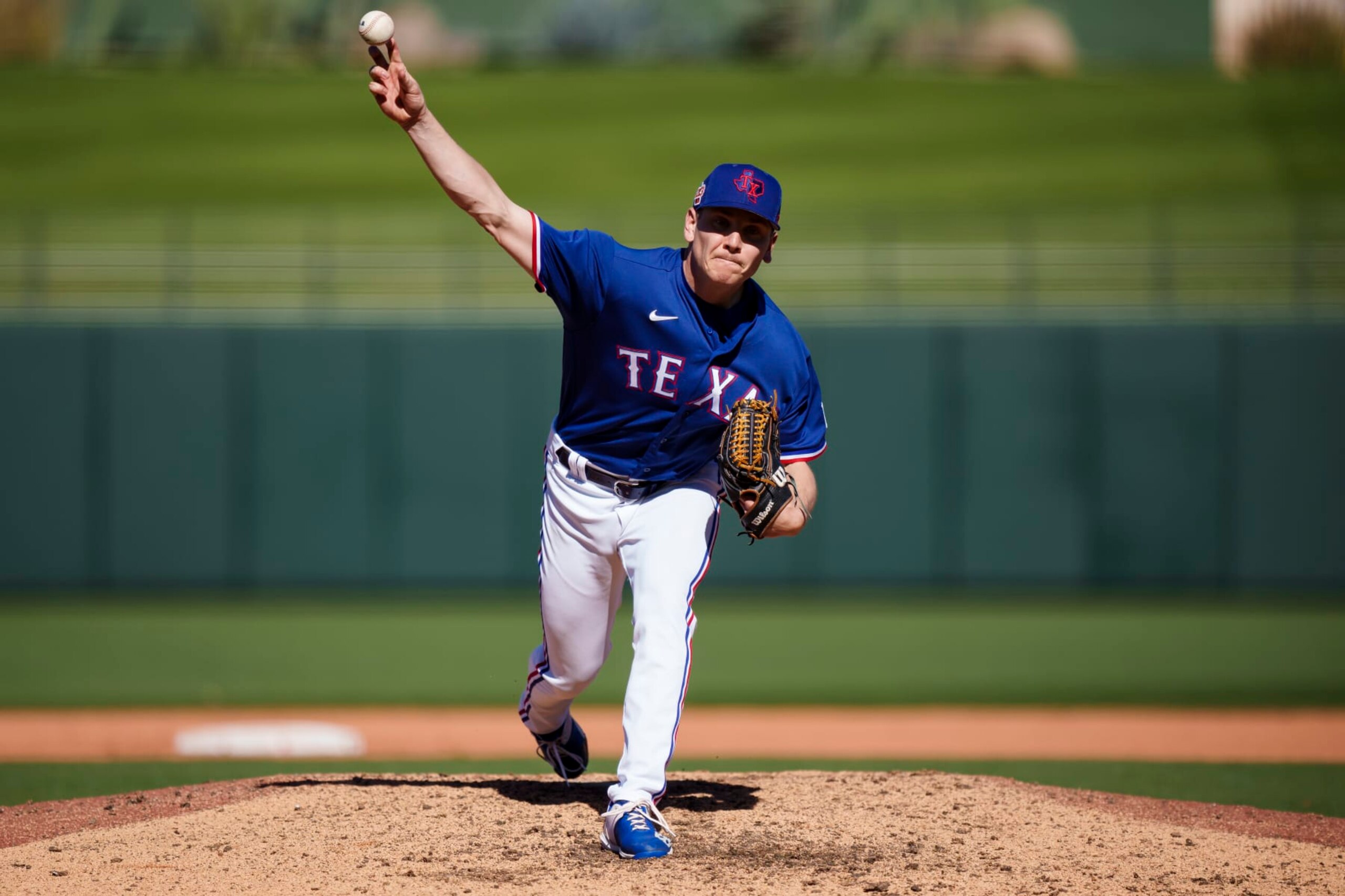 SURPRISE, AZ - FEBRUARY 25: Spencer Howard #36 of the Texas Rangers delivers a pitch during a spring training game against the Kansas City Royals at Surprise Stadium on February 25, 2023 in Surprise, Arizona. (Photo by Ben Ludeman/Texas Rangers/Getty Images)