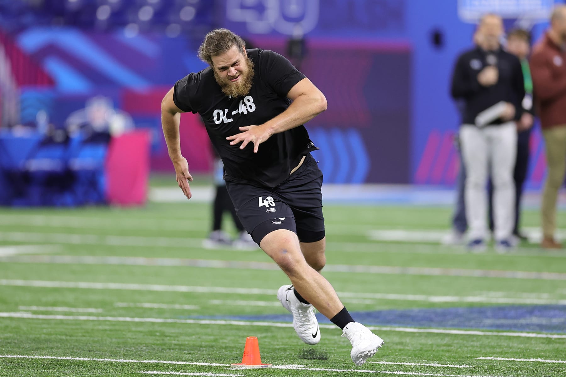 INDIANAPOLIS, INDIANA - MARCH 05: Dalton Wagner of the Arkansas participates in a drill during the NFL Combine at Lucas Oil Stadium on March 05, 2023 in Indianapolis, Indiana. (Photo by Stacy Revere/Getty Images)