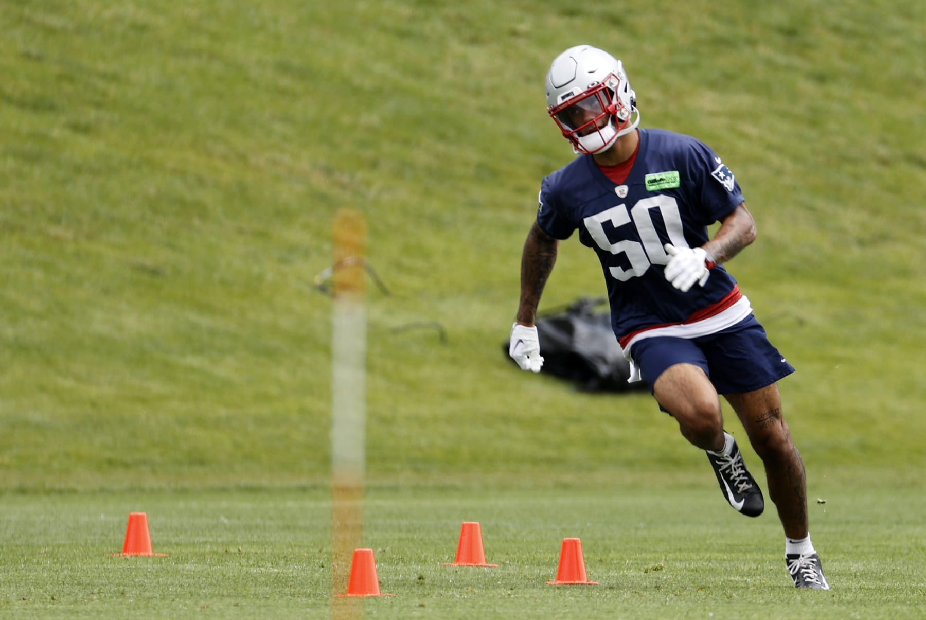 FOXBOROUGH, MA - JUNE 13: New England Patriots cornerback Christian Gonzalez (50) rounds the agility cones during New England Patriots Minicamp on June 13, 2023, at the Patriots Practice Facility at Gillette Stadium in Foxborough, Massachusetts. (Photo by Fred Kfoury III/Icon Sportswire via Getty Images)