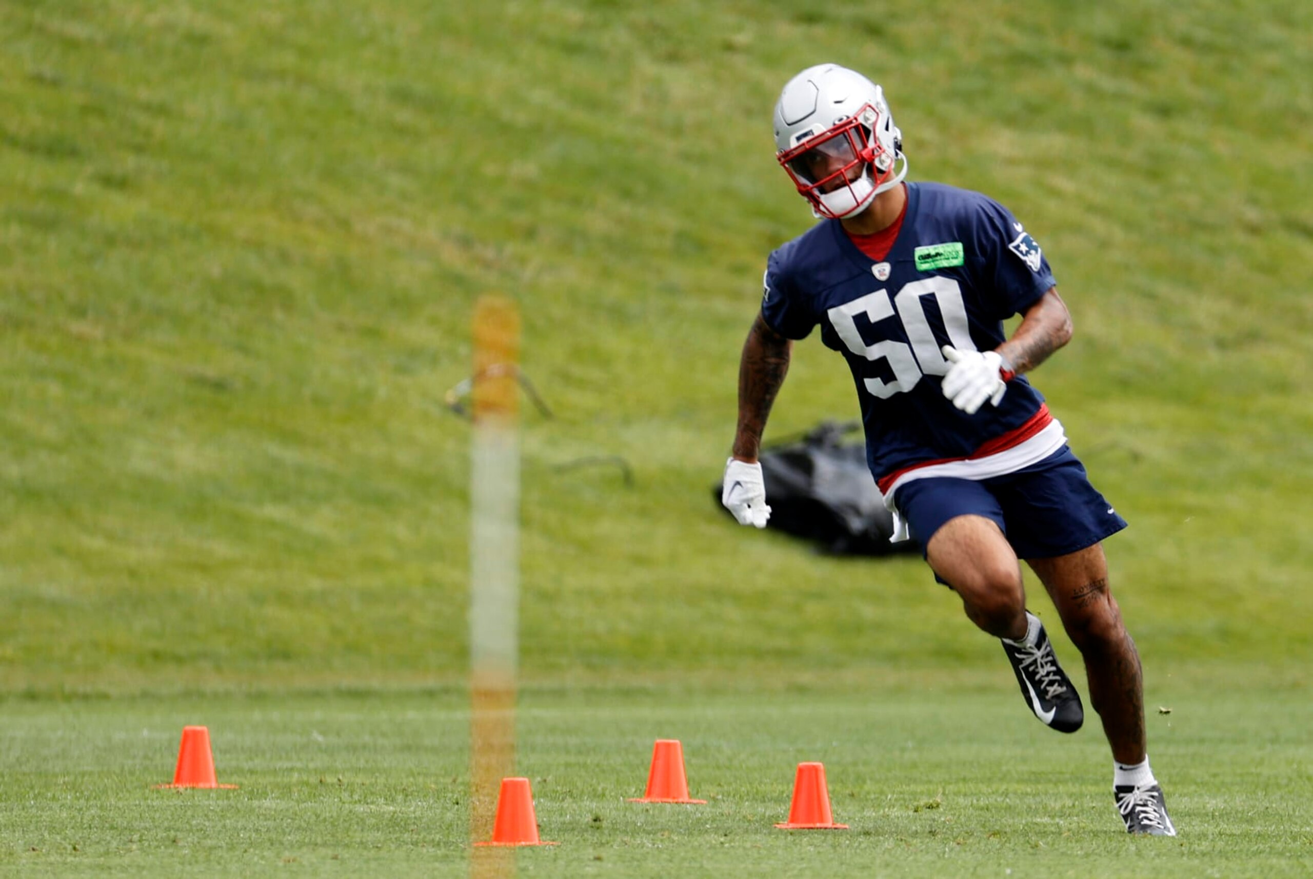FOXBOROUGH, MA - JUNE 13: New England Patriots cornerback Christian Gonzalez (50) rounds the agility cones during New England Patriots Minicamp on June 13, 2023, at the Patriots Practice Facility at Gillette Stadium in Foxborough, Massachusetts. (Photo by Fred Kfoury III/Icon Sportswire via Getty Images)