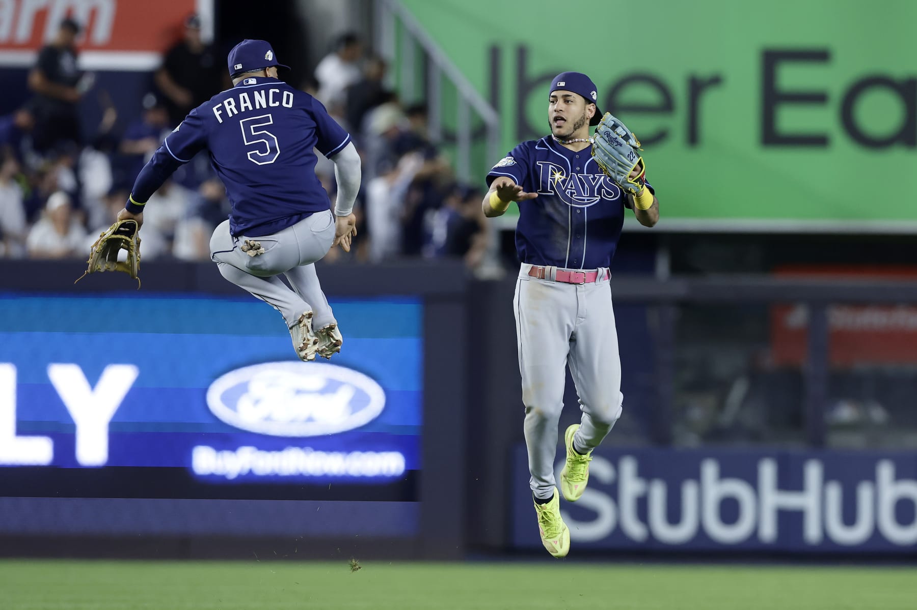 NEW YORK, NEW YORK - JULY 31:  Wander Franco #5 and Jose Siri #22 of the Tampa Bay Rays celebrate after defeating the New York Yankees at Yankee Stadium on July 31, 2023 in Bronx borough of New York City. (Photo by Jim McIsaac/Getty Images)