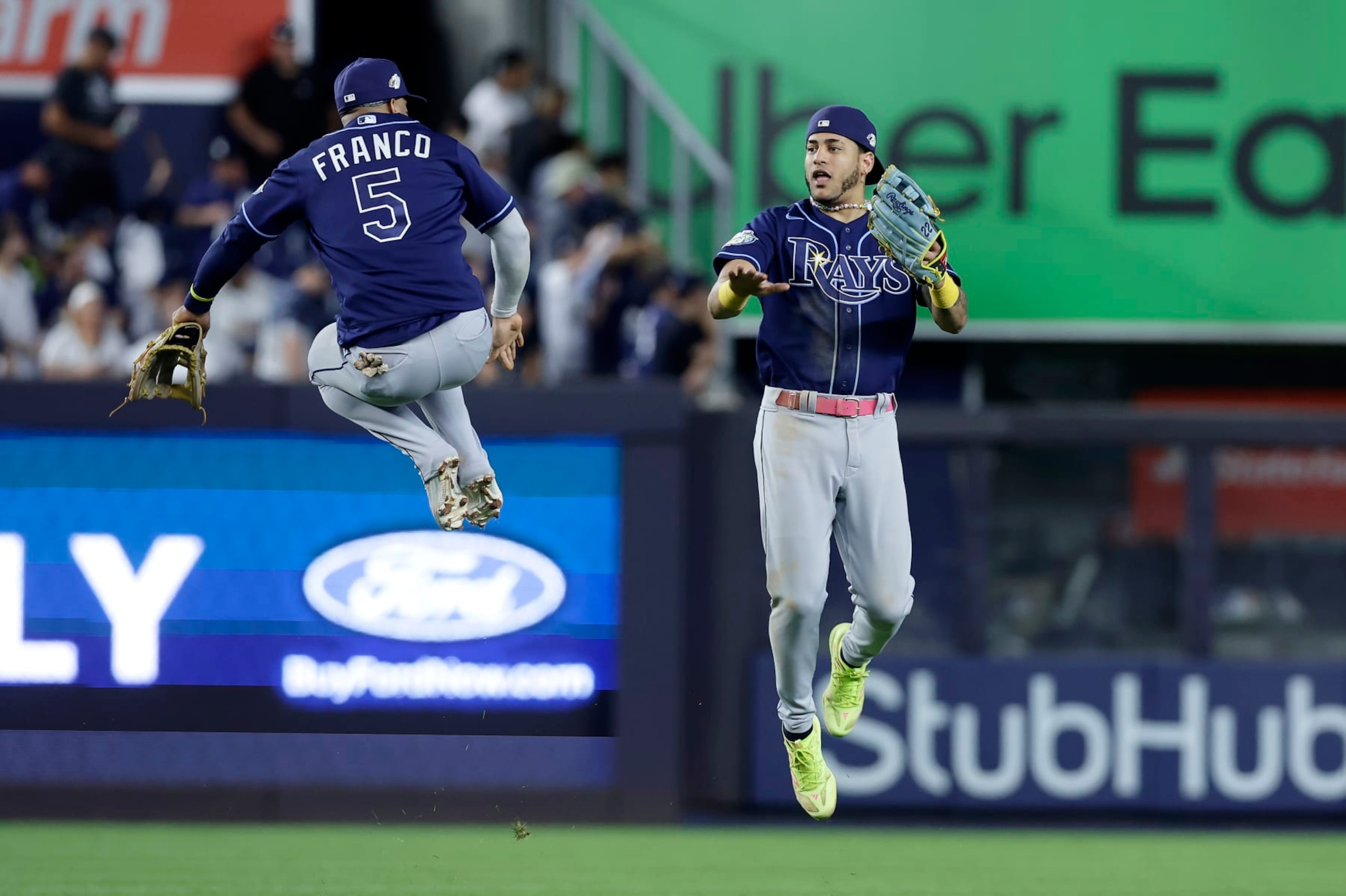 NEW YORK, NEW YORK - JULY 31:  Wander Franco #5 and Jose Siri #22 of the Tampa Bay Rays celebrate after defeating the New York Yankees at Yankee Stadium on July 31, 2023 in Bronx borough of New York City. (Photo by Jim McIsaac/Getty Images)