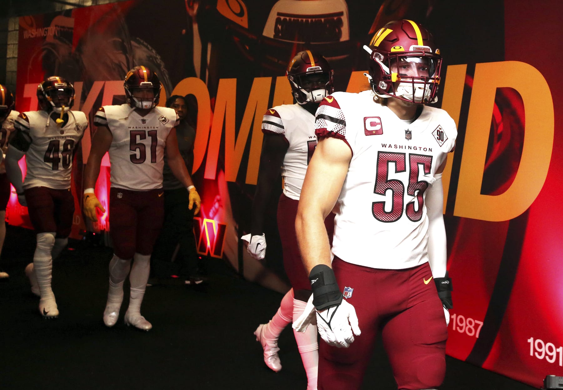 Washington Commanders linebacker Cole Holcomb (55) is introduced before an NFL football game against the Philadelphia Eagles, Sunday, Sept. 25, 2022 in Landover, Md. (AP Photo/Daniel Kucin Jr.)