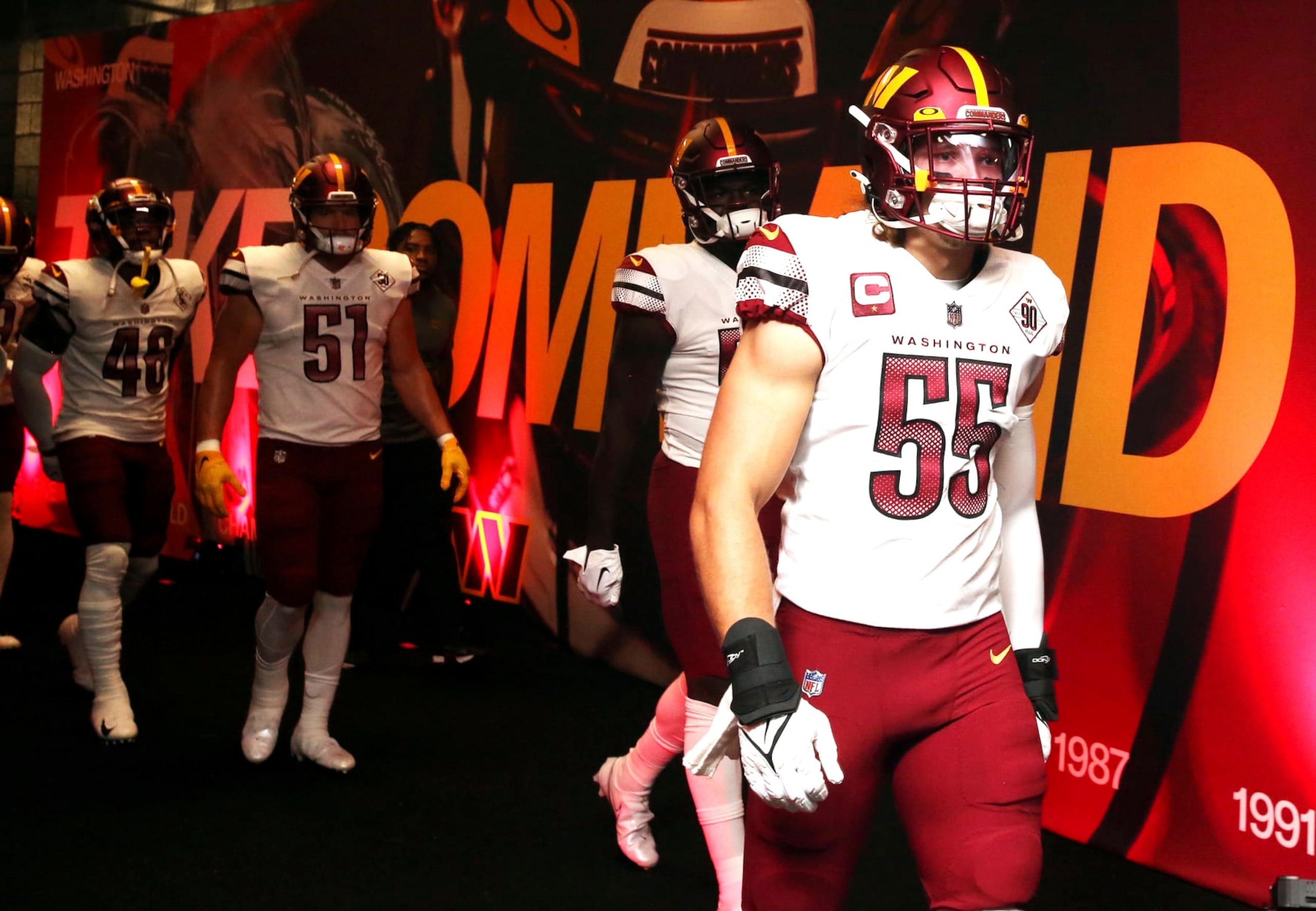 Washington Commanders linebacker Cole Holcomb (55) is introduced before an NFL football game against the Philadelphia Eagles, Sunday, Sept. 25, 2022 in Landover, Md. (AP Photo/Daniel Kucin Jr.)