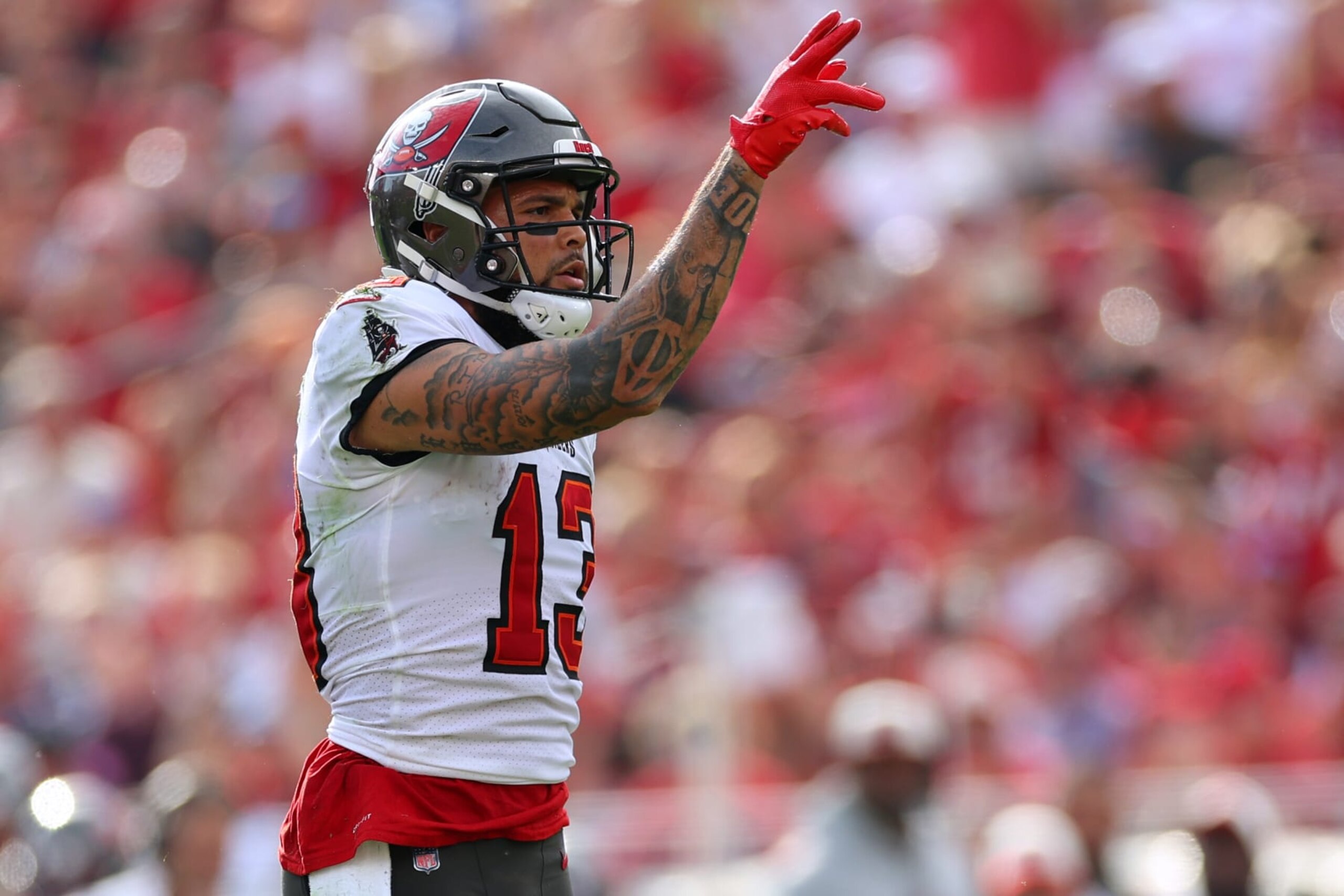TAMPA, FLORIDA - JANUARY 01: Mike Evans #13 of the Tampa Bay Buccaneers reacts after making a first down during the third quarter against the Carolina Panthers at Raymond James Stadium on January 01, 2023 in Tampa, Florida. (Photo by Mike Ehrmann/Getty Images) TAMPA, FLORIDA - JANUARY 01: Mike Evans #13 of the Tampa Bay Buccaneers reacts after making a first down during the third quarter against the Carolina Panthers at Raymond James Stadium on January 01, 2023 in Tampa, Florida. (Photo by Mike Ehrmann/Getty Images)