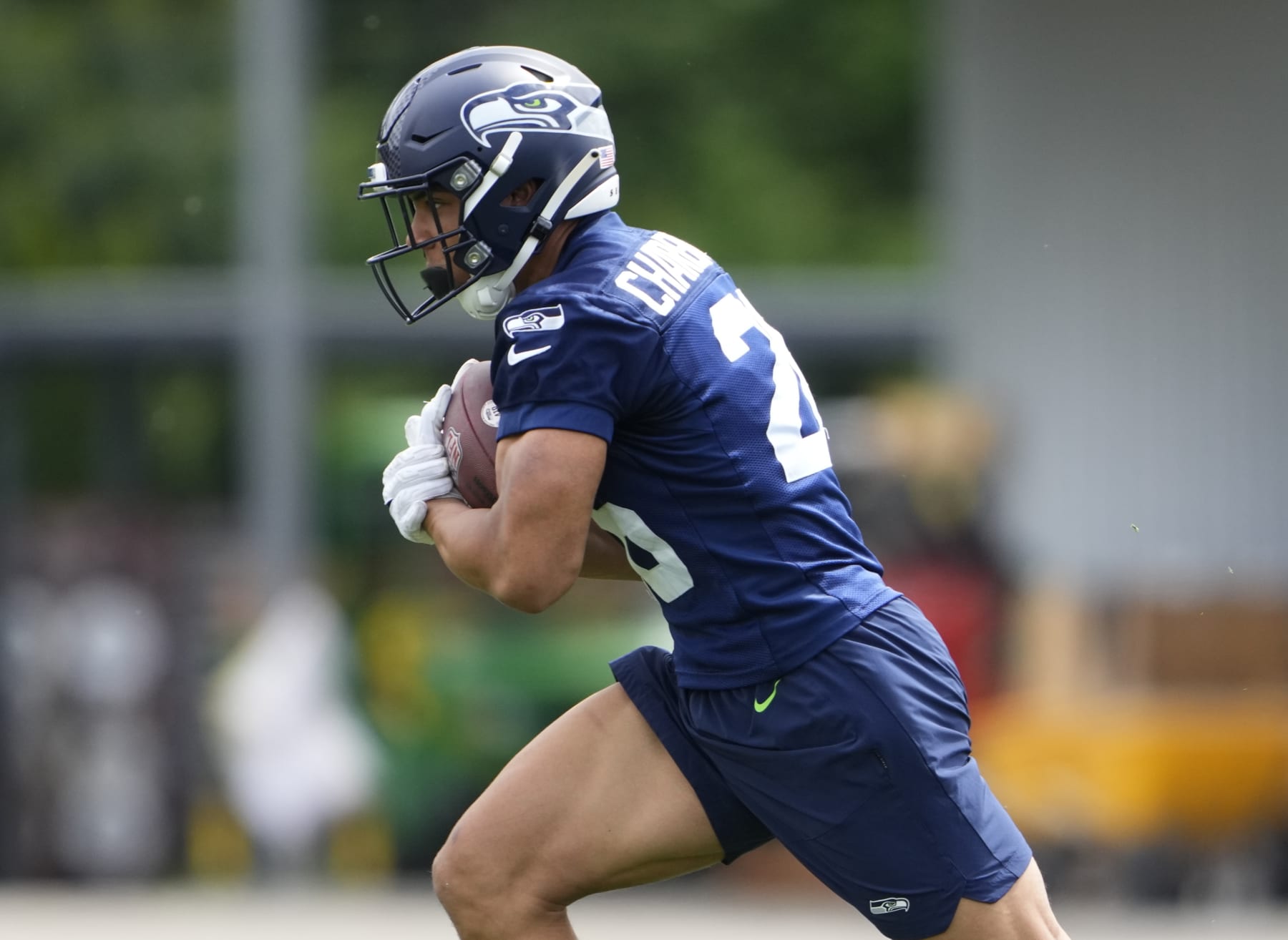 Seattle Seahawks running back Zach Charbonnet (26) holds the football during drills Monday, May 22, 2023, at the team's NFL football training facility in Renton, Wash. (AP Photo/Lindsey Wasson)