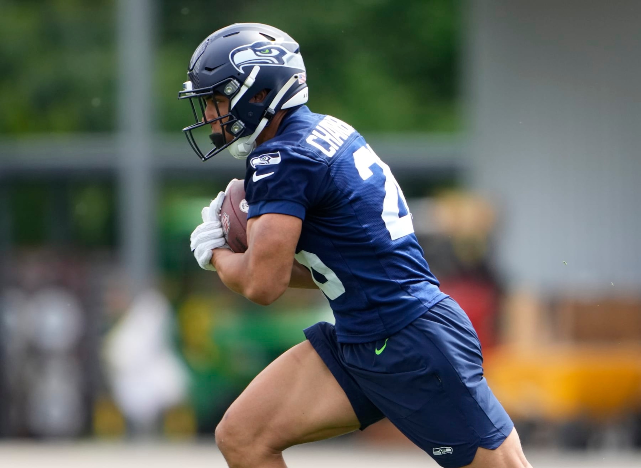 Seattle Seahawks running back Zach Charbonnet (26) holds the football during drills Monday, May 22, 2023, at the team's NFL football training facility in Renton, Wash. (AP Photo/Lindsey Wasson) Seattle Seahawks running back Zach Charbonnet (26) holds the football during drills Monday, May 22, 2023, at the team's NFL football training facility in Renton, Wash. (AP Photo/Lindsey Wasson)