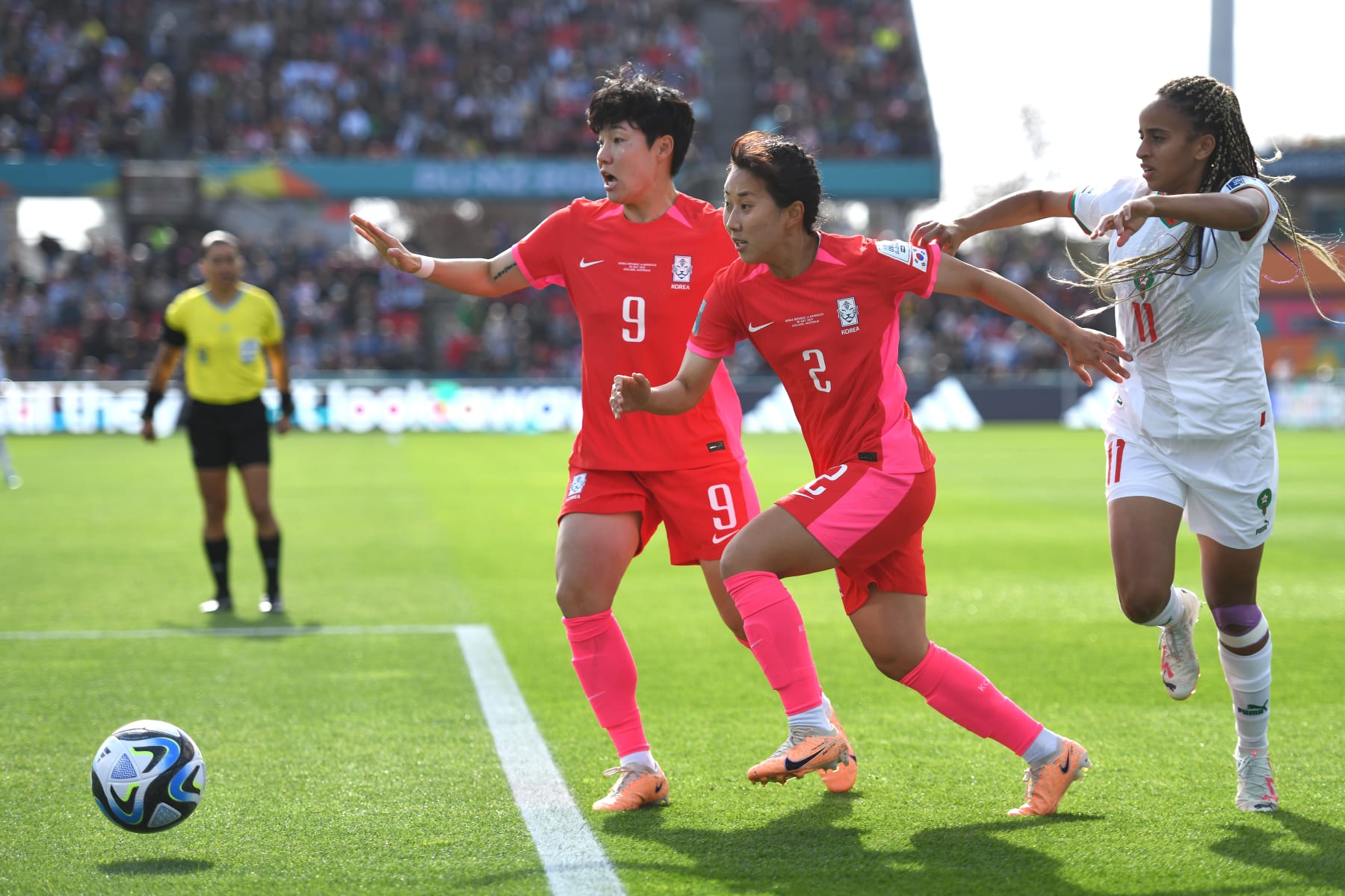 ADELAIDE, AUSTRALIA - JULY 30: (L-R) Geummin Lee and Hyojoo Choo of Korea Republic, and Fatima Tagnaout of Morocco in action during the FIFA Women's World Cup Australia & New Zealand 2023 Group H match between South Korea and Morocco at Hindmarsh Stadium on July 30, 2023 in Adelaide, Australia. (Photo by Sue McKay/Getty Images)