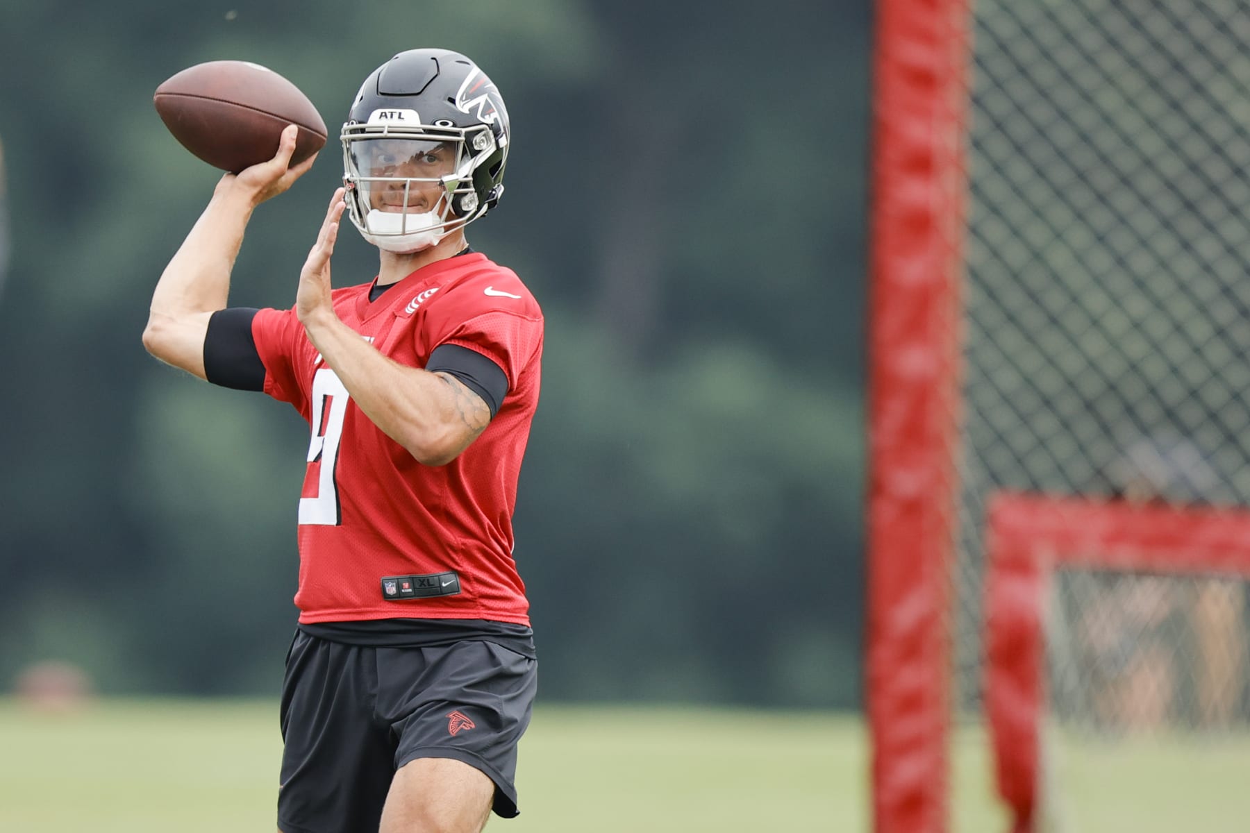 Atlanta Falcons quarterback Desmond Ridder (9) works on a passing drill during the team's NFL football training camp on Saturday, July 29, 2023, in Flowery Branch, Ga. (AP Photo/Alex Slitz)