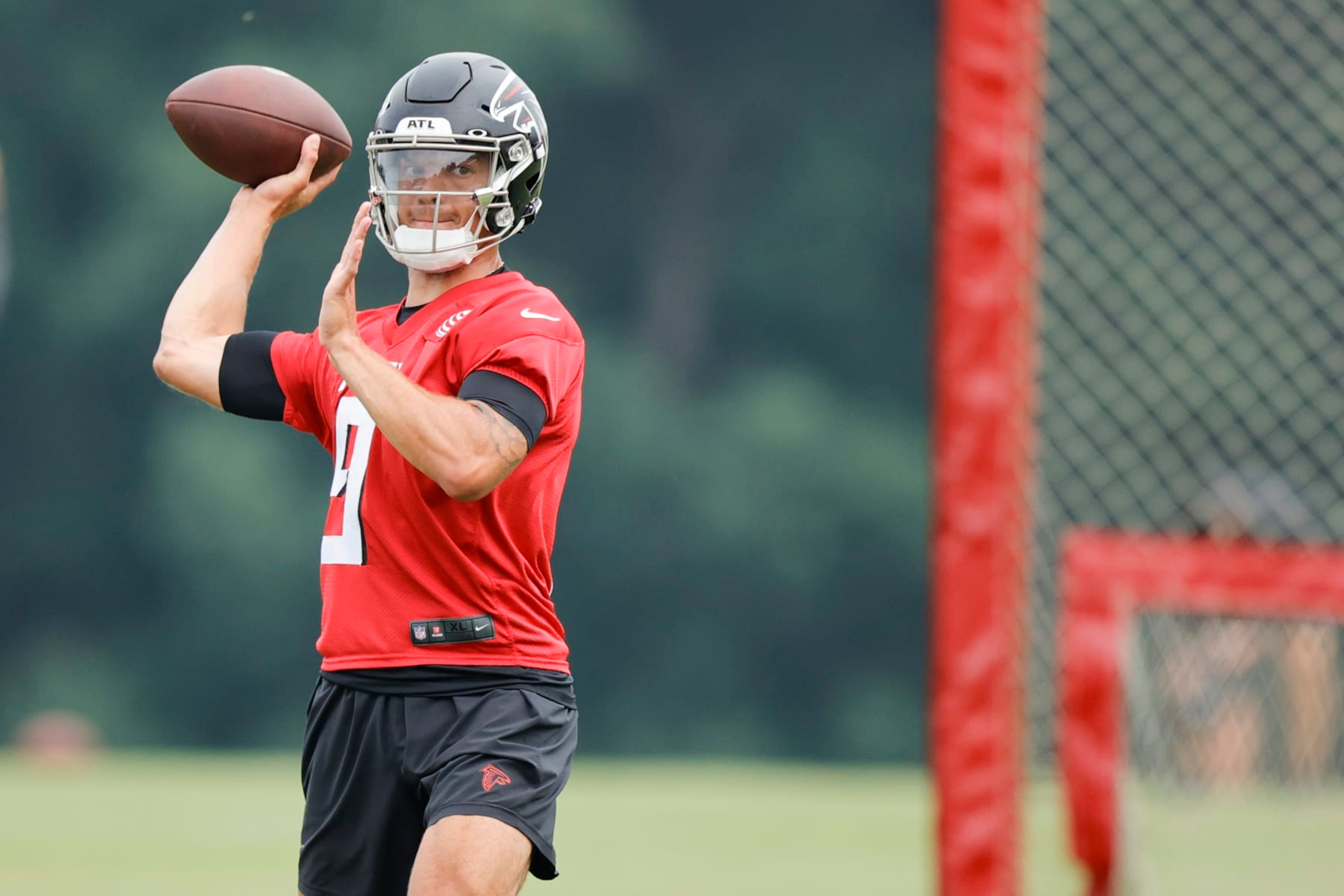 Atlanta Falcons quarterback Desmond Ridder (9) works on a passing drill during the team's NFL football training camp on Saturday, July 29, 2023, in Flowery Branch, Ga. (AP Photo/Alex Slitz)
