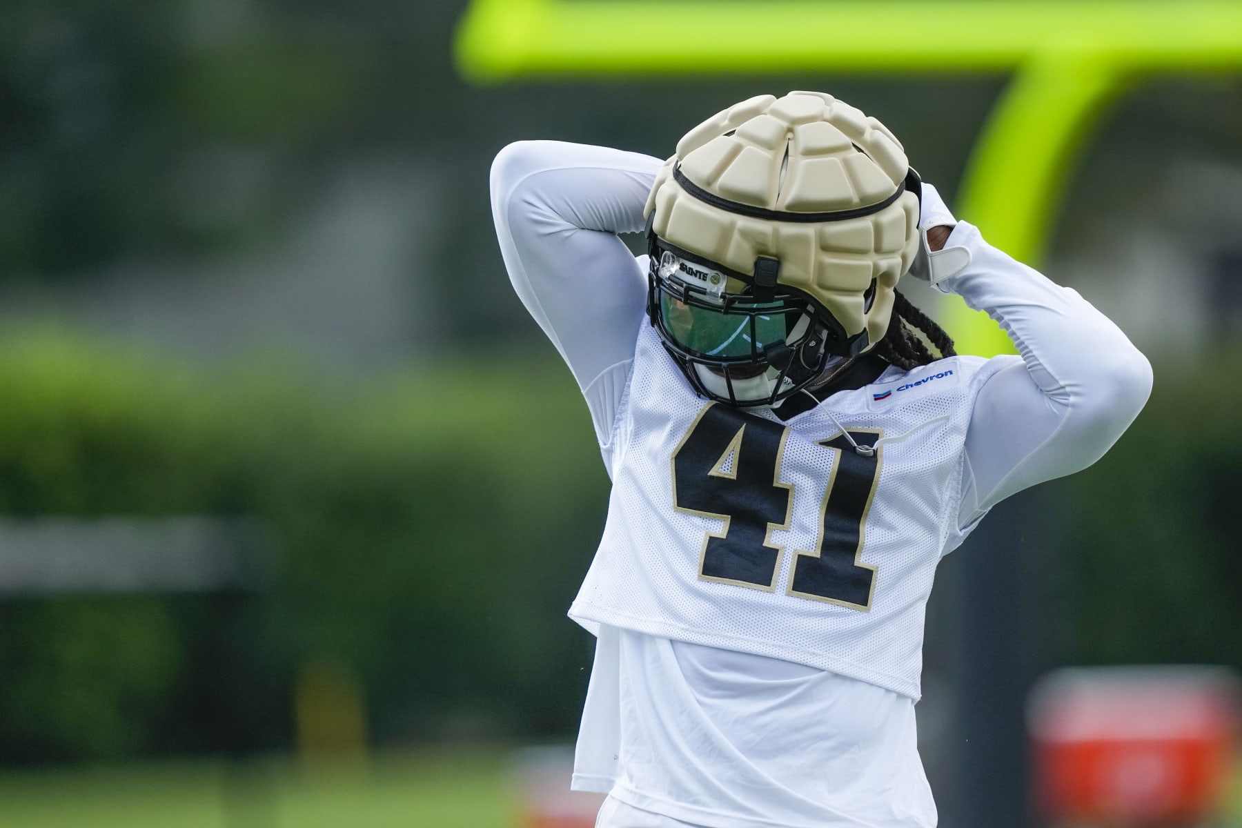 New Orleans Saints running back Alvin Kamara (41) adjusts his equipment at the team's NFL football training camp in Metairie, La., Wednesday, July 26, 2023. (AP Photo/Gerald Herbert)