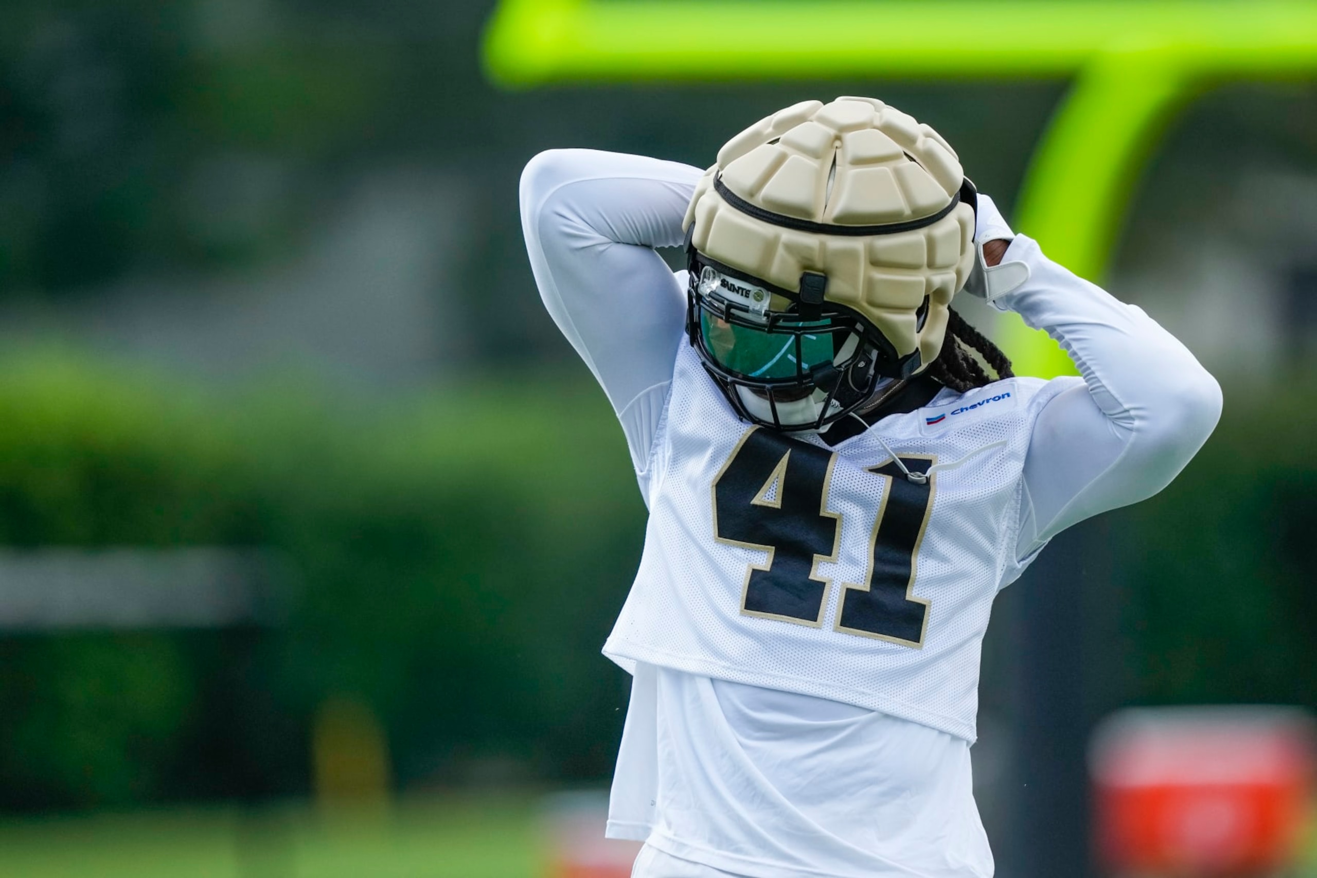 New Orleans Saints running back Alvin Kamara (41) adjusts his equipment at the team's NFL football training camp in Metairie, La., Wednesday, July 26, 2023. (AP Photo/Gerald Herbert)