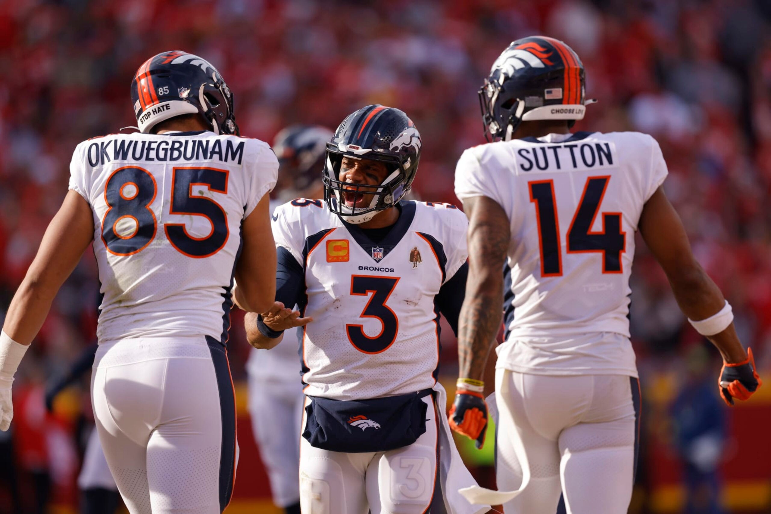 KANSAS CITY, MISSOURI - JANUARY 01: Russell Wilson #3 of the Denver Broncos celebrates a touchdown pass to Albert Okwuegbunam #85 during the third quarter in the game against the Kansas City Chiefs at Arrowhead Stadium on January 01, 2023 in Kansas City, Missouri. (Photo by David Eulitt/Getty Images)