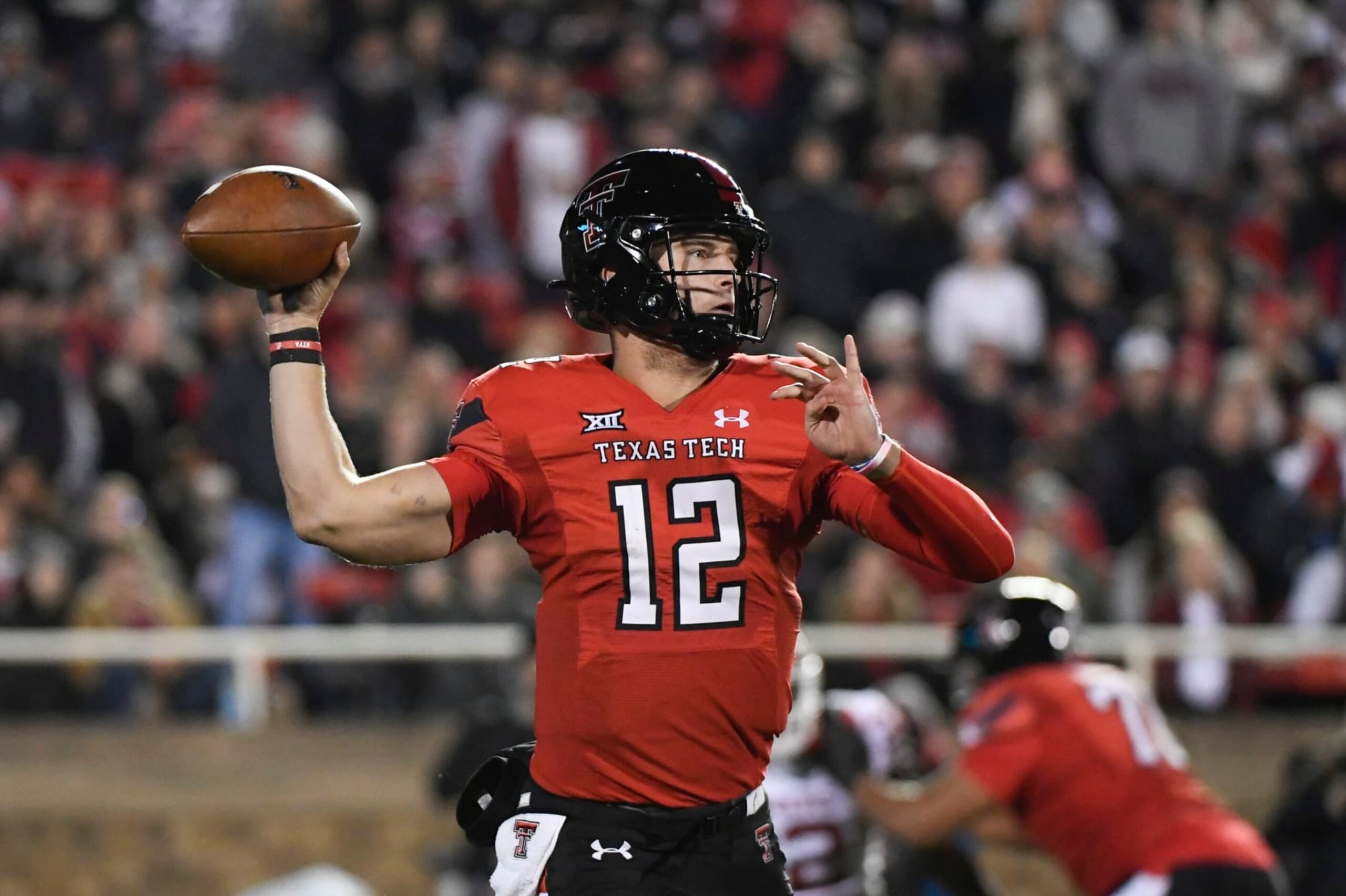 Texas Tech quarterback Tyler Shough (12) attempts to throw a pass against Oklahoma during the first half of an NCAA college football game Saturday, Nov. 26, 2022, in Lubbock, Texas. (AP Photo/Justin Rex) Texas Tech quarterback Tyler Shough (12) attempts to throw a pass against Oklahoma during the first half of an NCAA college football game Saturday, Nov. 26, 2022, in Lubbock, Texas. (AP Photo/Justin Rex)