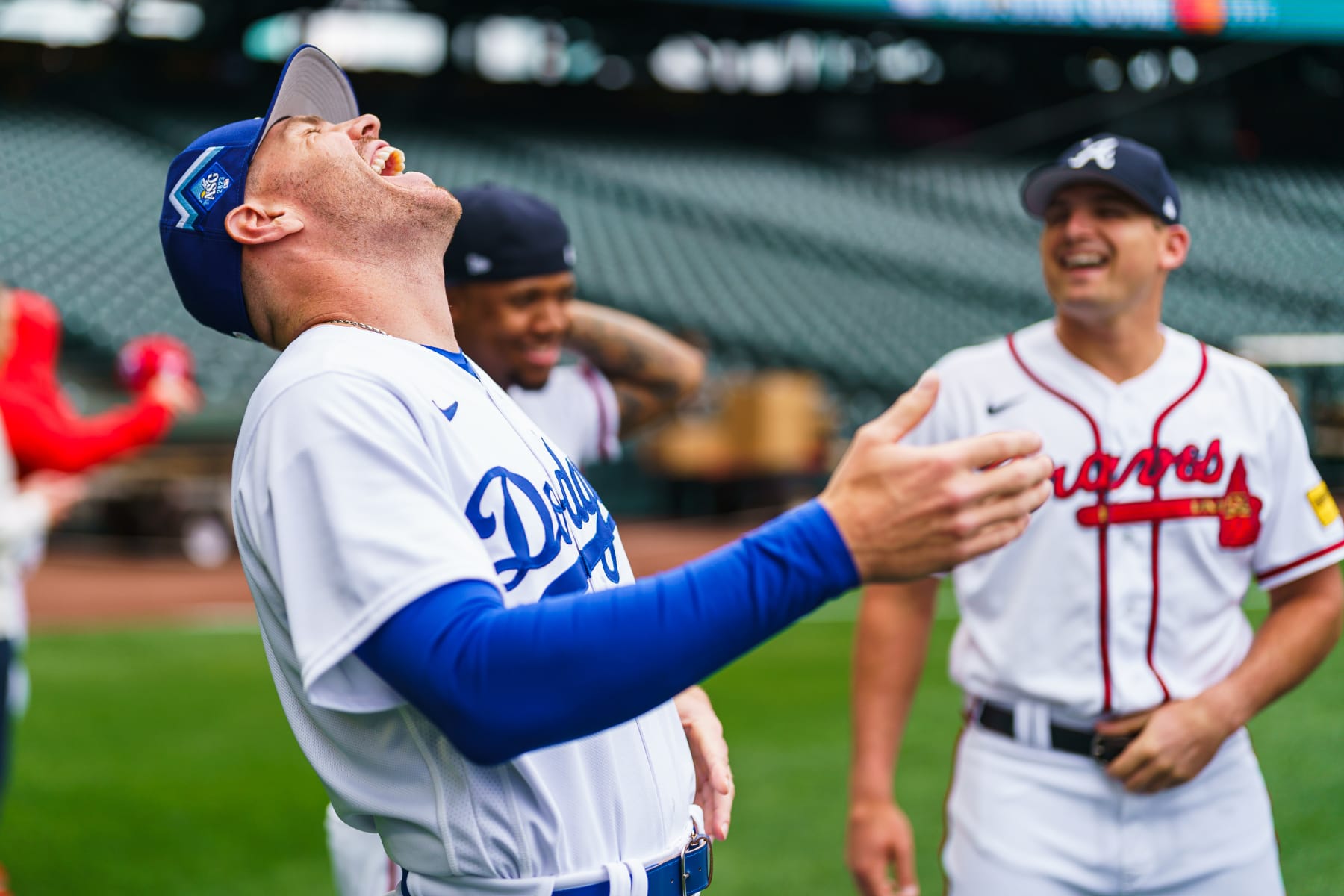 SEATTLE, WA - JULY 10: Freddie Freeman #5 of the Los Angeles Dodgers laughs with former teammates Austin Riley #27 of the Atlanta Braves and Ronald Acuna Jr. #13 during the Gatorade All-Star Workout Day at T-Mobile Park on July 10, 2023 in Seattle, Washington. (Photo by Matthew Grimes Jr./Atlanta Braves/Getty Images)
