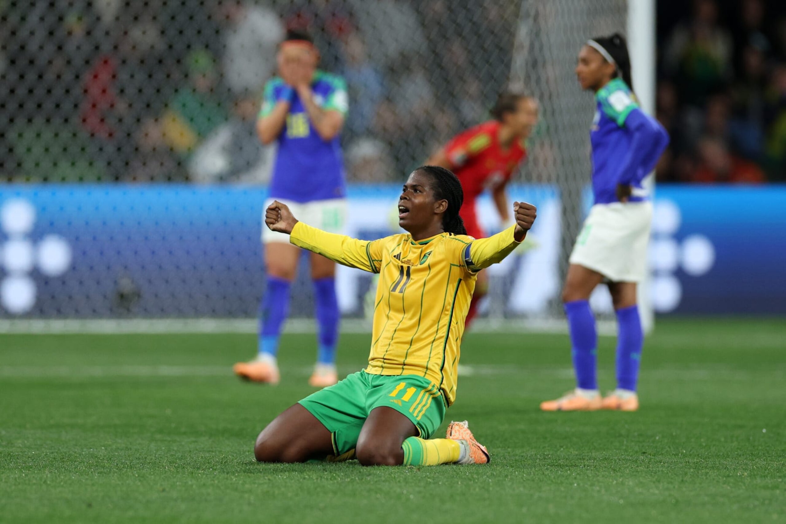 MELBOURNE, AUSTRALIA - AUGUST 02: Khadija Shaw of  Jamaica celebrates advancing to the knockout stage after the scoreless draw in the FIFA Women's World Cup Australia & New Zealand 2023 Group F match between Jamaica and Brazil at Melbourne Rectangular Stadium on August 02, 2023 in Melbourne, Australia. (Photo by Elsa - FIFA/FIFA via Getty Images)