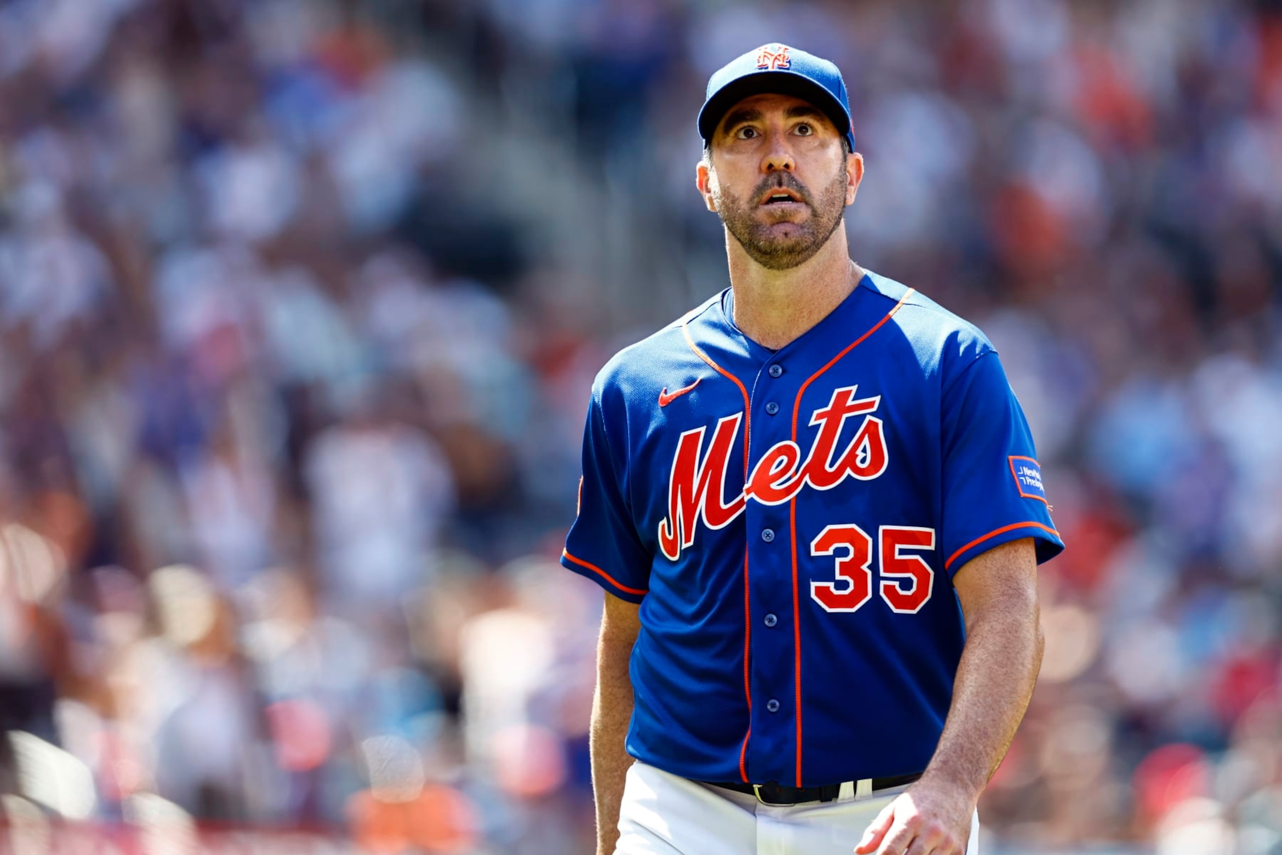 NEW YORK, NEW YORK - JULY 30: Pitcher Justin Verlander #35 of the New York Mets looks at the crowd after being relieved in the sixth inning of a game against the Washington Nationals at Citi Field on July 30, 2023 in New York City. The Mets defeated the Nationals 5-2 as Verlander recorded his 250th career win. (Photo by Rich Schultz/Getty Images)