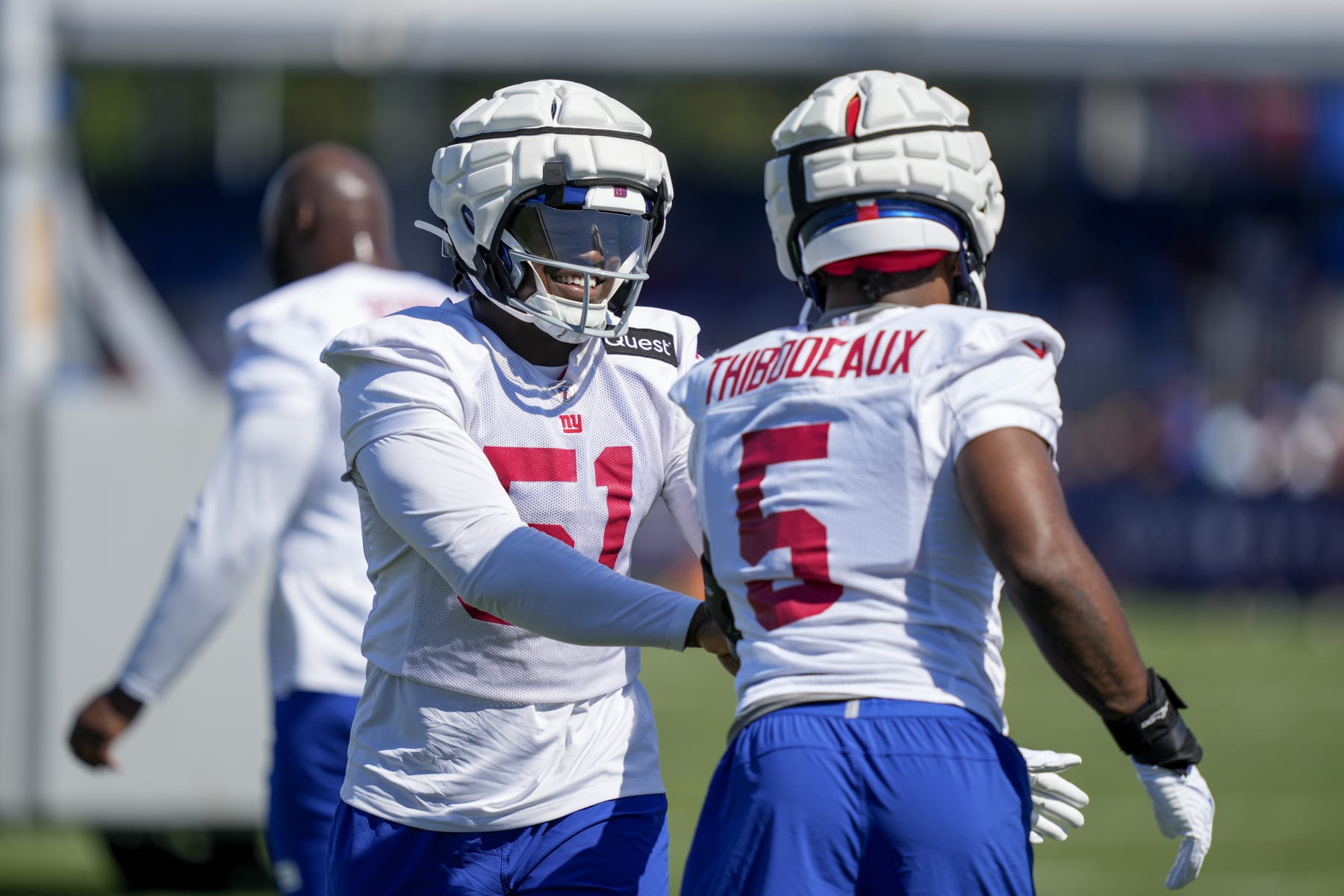 New York Giants linebackers Azeez Ojulari (51) and Kayvon Thibodeaux (5) participate in training activities at the NFL football team's practice facility, Sunday, July 30, 2023, in East Rutherford. (AP Photo/John Minchillo)