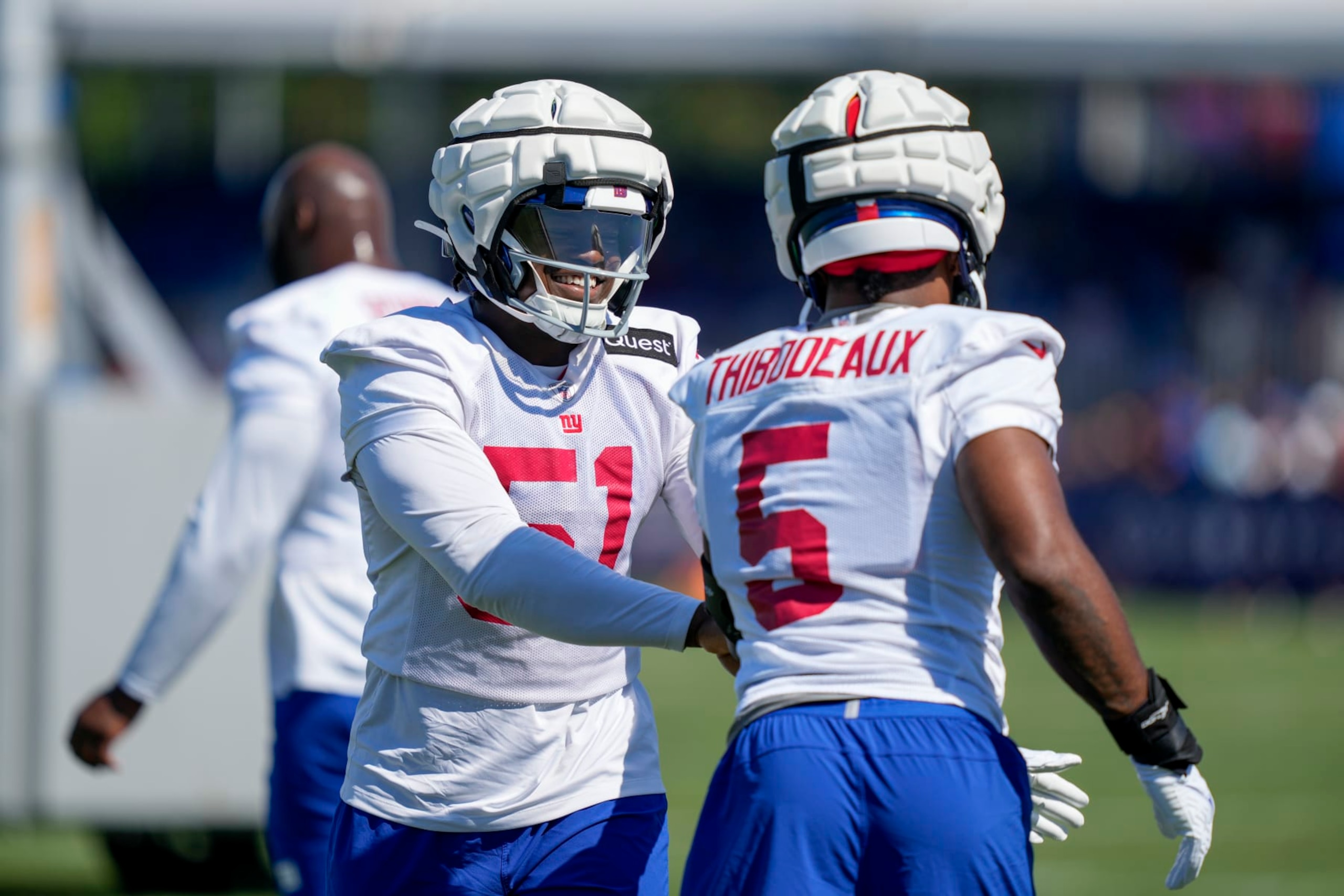 New York Giants linebackers Azeez Ojulari (51) and Kayvon Thibodeaux (5) participate in training activities at the NFL football team's practice facility, Sunday, July 30, 2023, in East Rutherford. (AP Photo/John Minchillo)