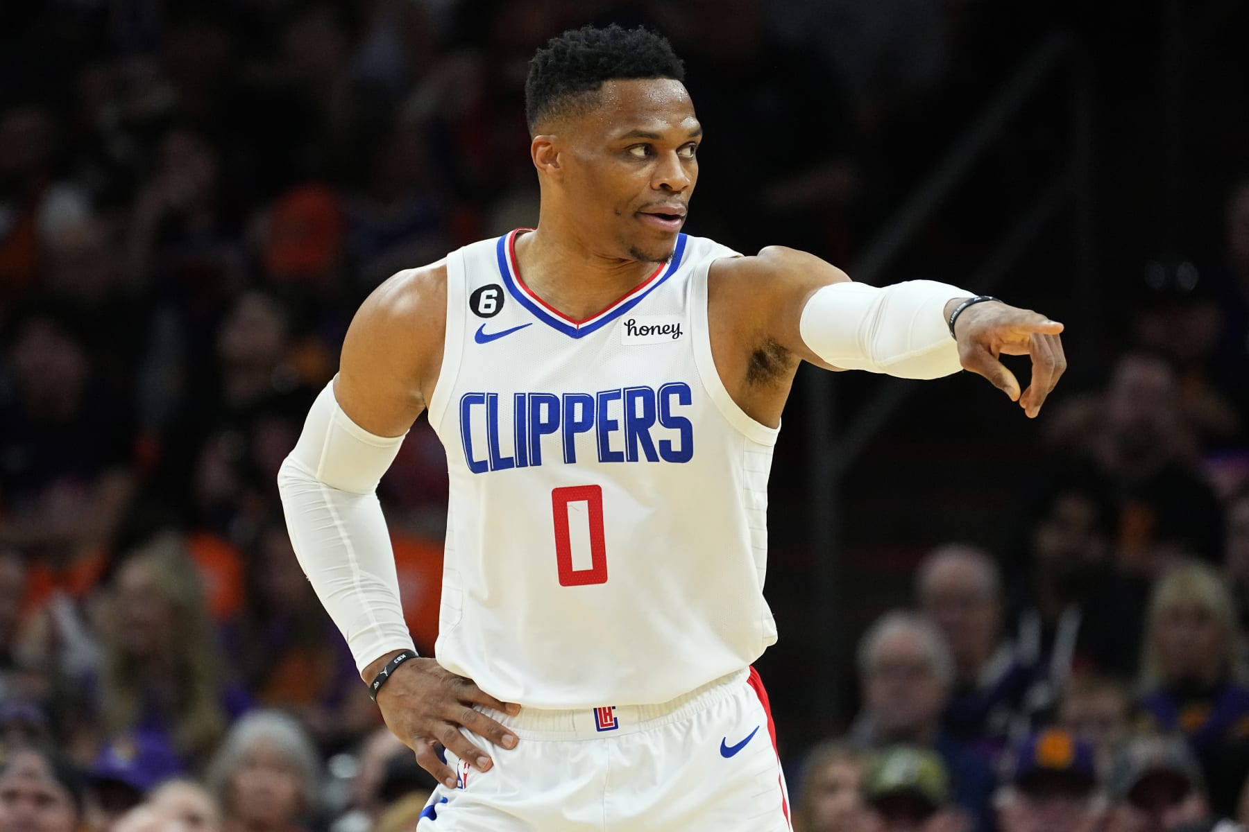 Los Angeles Clippers guard Russell Westbrook (0) motions to a teammate during Game 5 of a first-round NBA basketball playoff series against the Phoenix Suns, Tuesday, April 25, 2023, in Phoenix. (AP Photo/Matt York)