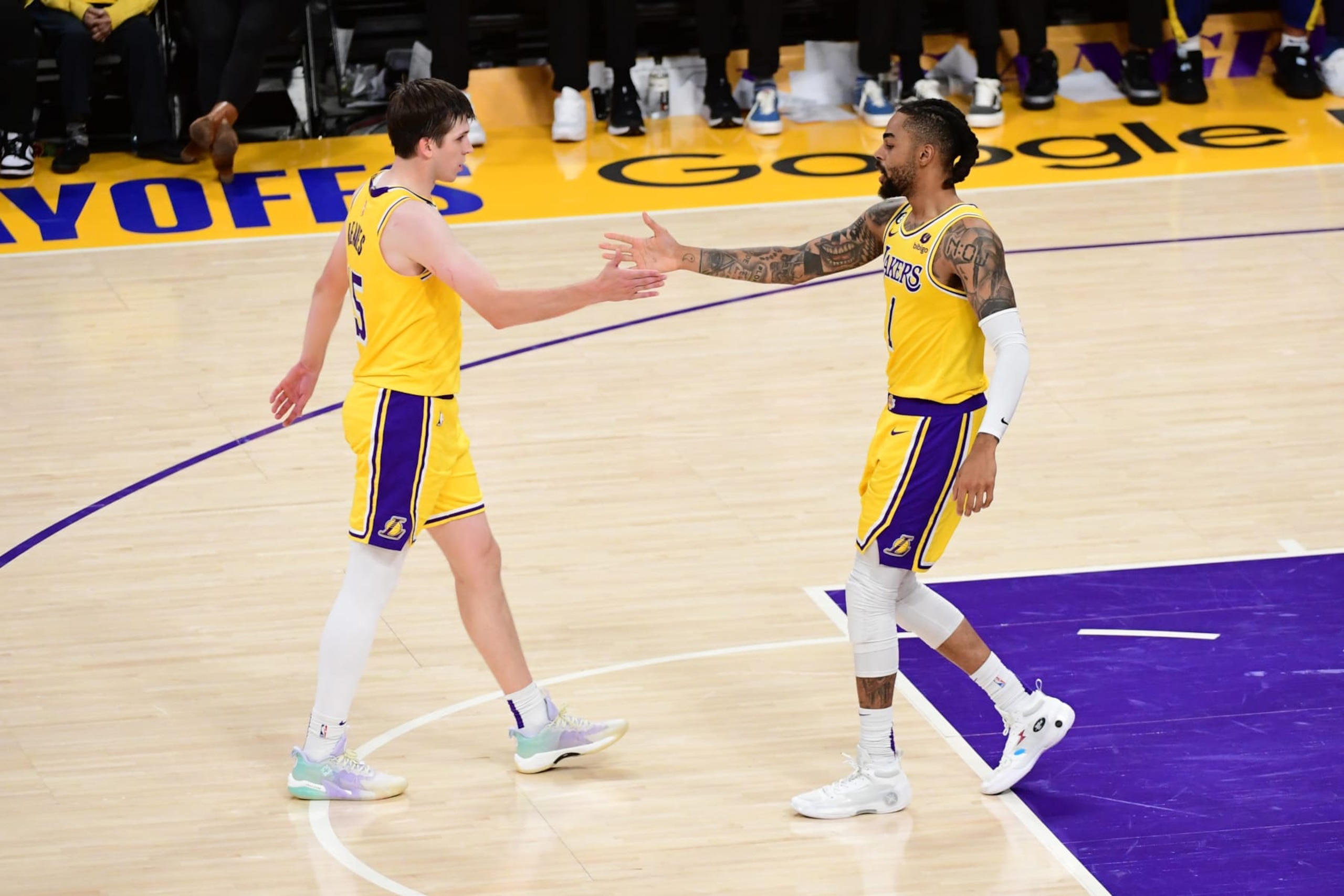 LOS ANGELES, CA - MAY 12: Austin Reaves #15/ and D'Angelo Russell #1 of the Los Angeles Lakers high five during the game against the Golden State Warriors during the Western Conference Semi-Finals of the 2023 NBA Playoffs on May 12, 2023 at Crypto.Com Arena in Los Angeles, California. NOTE TO USER: User expressly acknowledges and agrees that, by downloading and/or using this Photograph, user is consenting to the terms and conditions of the Getty Images License Agreement. Mandatory Copyright Notice: Copyright 2023 NBAE (Photo by Adam Pantozzi/NBAE via Getty Images)