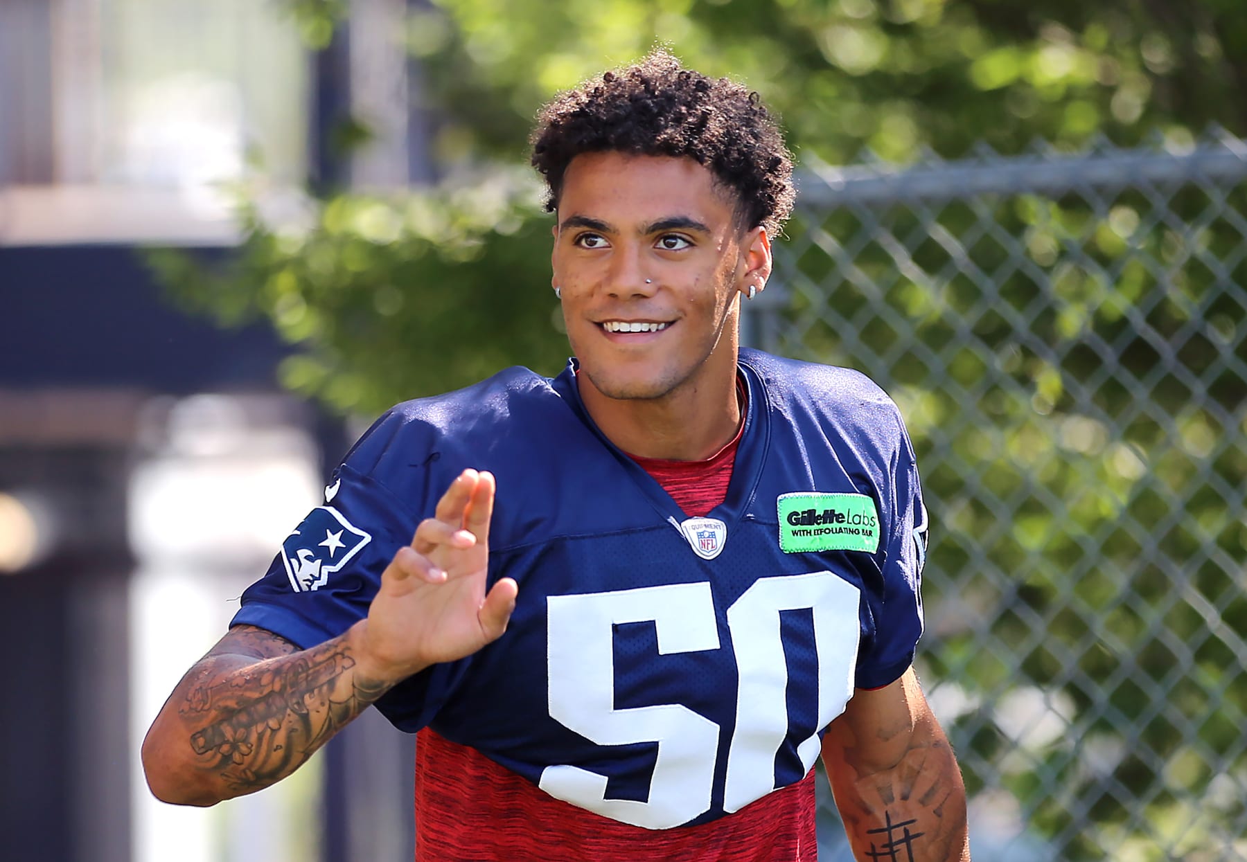 Foxborough, MA - July 28: New England Patriots CB Christian Gonzalez waves to fans. (Photo by John Tlumacki/The Boston Globe via Getty Images)