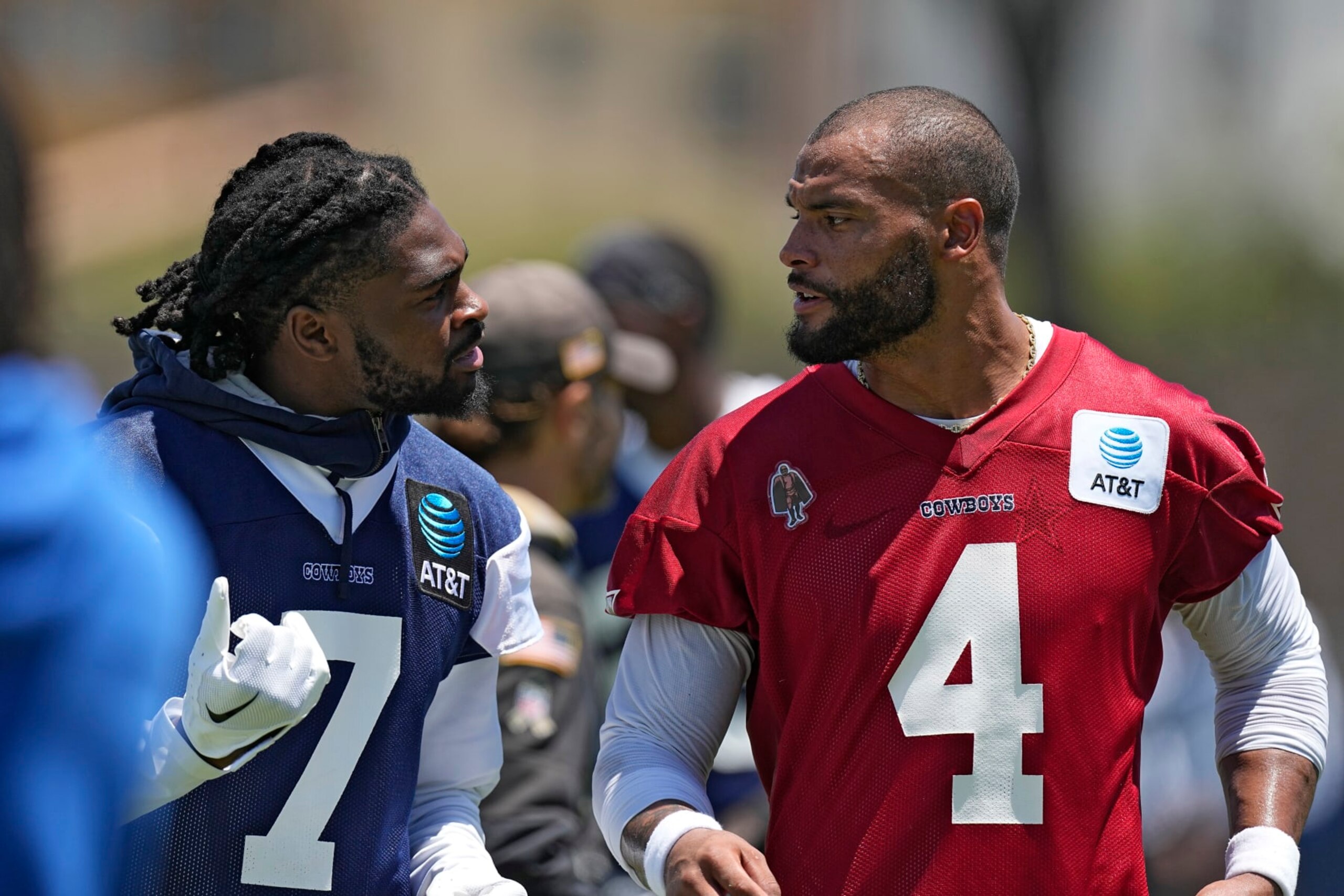 Dallas Cowboys cornerback Trevon Diggs, left, and quarterback Dak Prescott have a conversation during the NFL football team's training camp Wednesday, July 26, 2023, in Oxnard, Calif. (AP Photo/Mark J. Terrill)