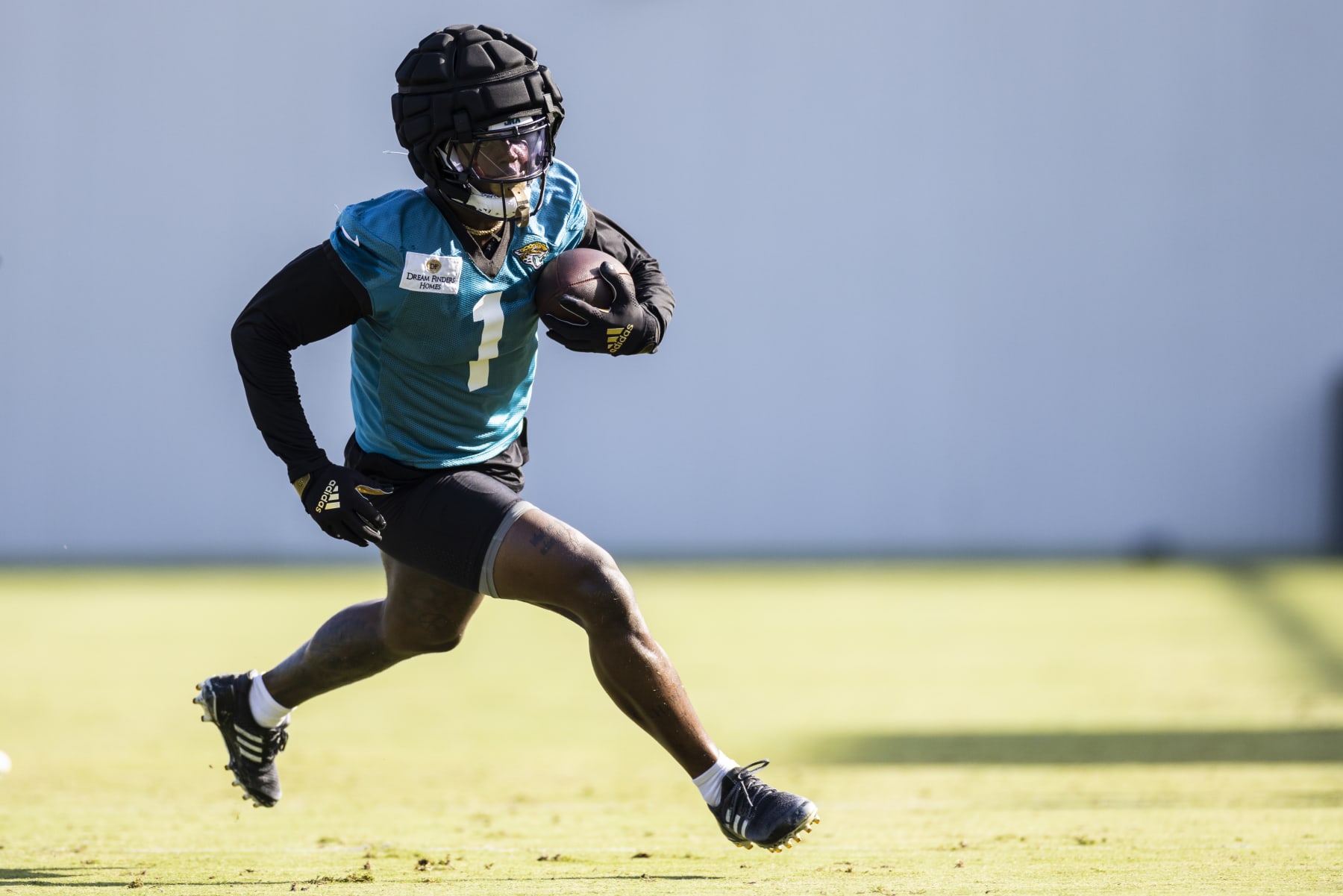 JACKSONVILLE, FLORIDA - AUGUST 03: Travis Etienne Jr. #1 of the Jacksonville Jaguars runs with the ball during Training Camp at Miller Electric Center on August 03, 2023 in Jacksonville, Florida. (Photo by James Gilbert/Getty Images)