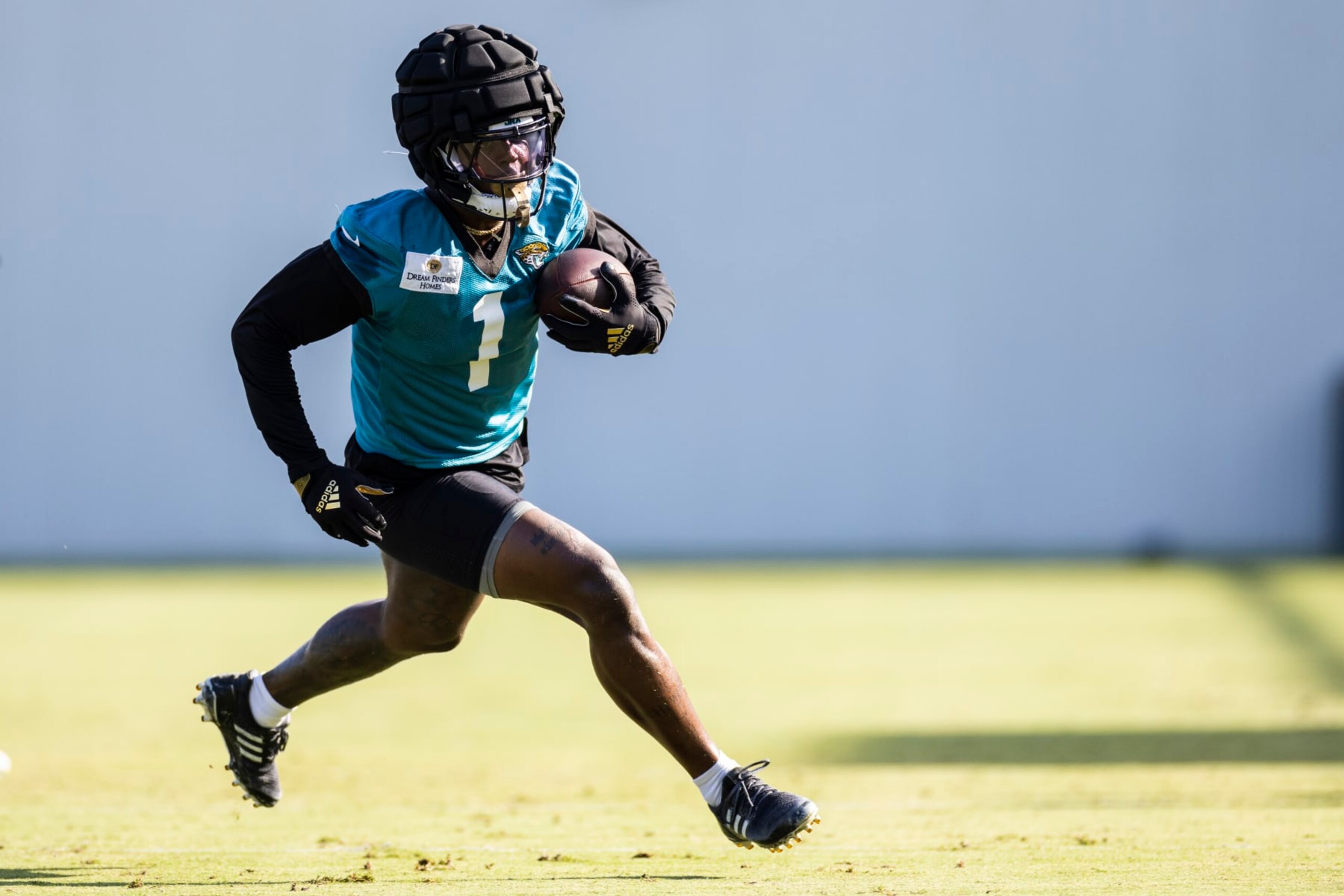 JACKSONVILLE, FLORIDA - AUGUST 03: Travis Etienne Jr. #1 of the Jacksonville Jaguars runs with the ball during Training Camp at Miller Electric Center on August 03, 2023 in Jacksonville, Florida. (Photo by James Gilbert/Getty Images)