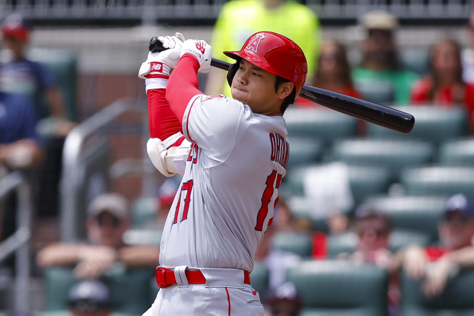 ATLANTA, GEORGIA - AUGUST 2: Shohei Ohtani #17 of the Los Angeles Angels hits a single during the sixth inning against the Atlanta Braves at Truist Park on August 2, 2023 in Atlanta, Georgia. (Photo by Todd Kirkland/Getty Images)