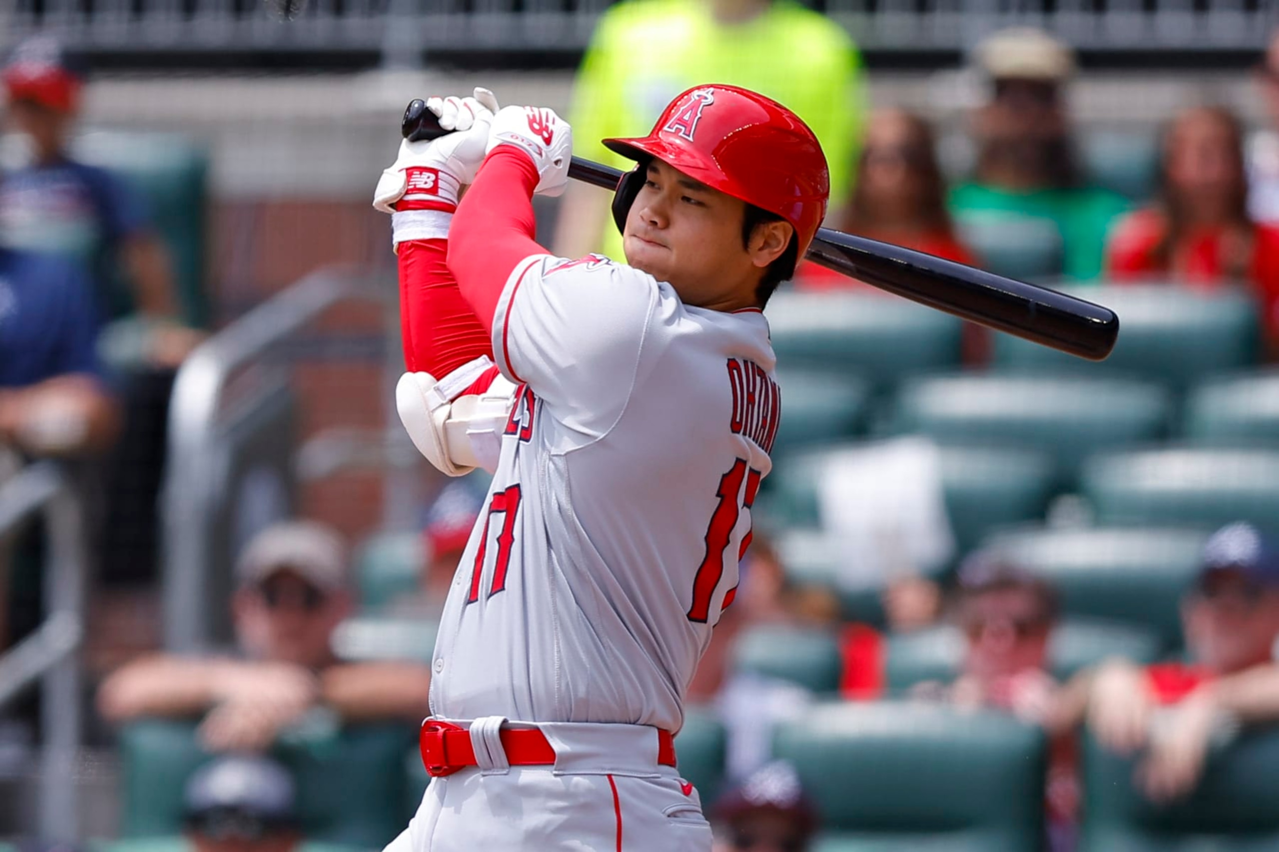 ATLANTA, GEORGIA - AUGUST 2: Shohei Ohtani #17 of the Los Angeles Angels hits a single during the sixth inning against the Atlanta Braves at Truist Park on August 2, 2023 in Atlanta, Georgia. (Photo by Todd Kirkland/Getty Images)