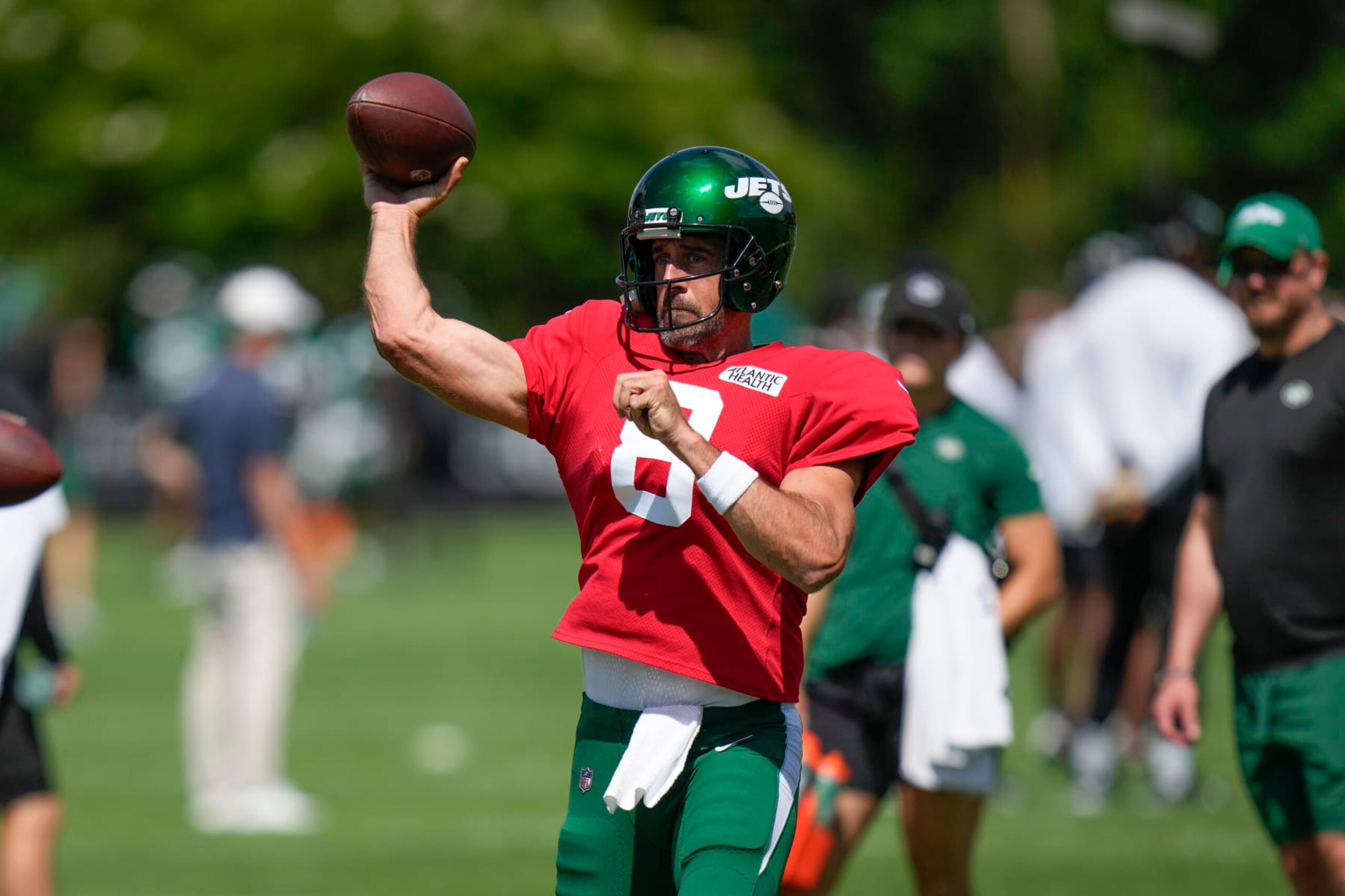 New York Jets quarterback Aaron Rodgers throws during a practice session at the NFL football team's training facility in Florham Park, N.J., Sunday, July 30, 2023. (AP Photo/Seth Wenig) New York Jets quarterback Aaron Rodgers throws during a practice session at the NFL football team's training facility in Florham Park, N.J., Sunday, July 30, 2023. (AP Photo/Seth Wenig)