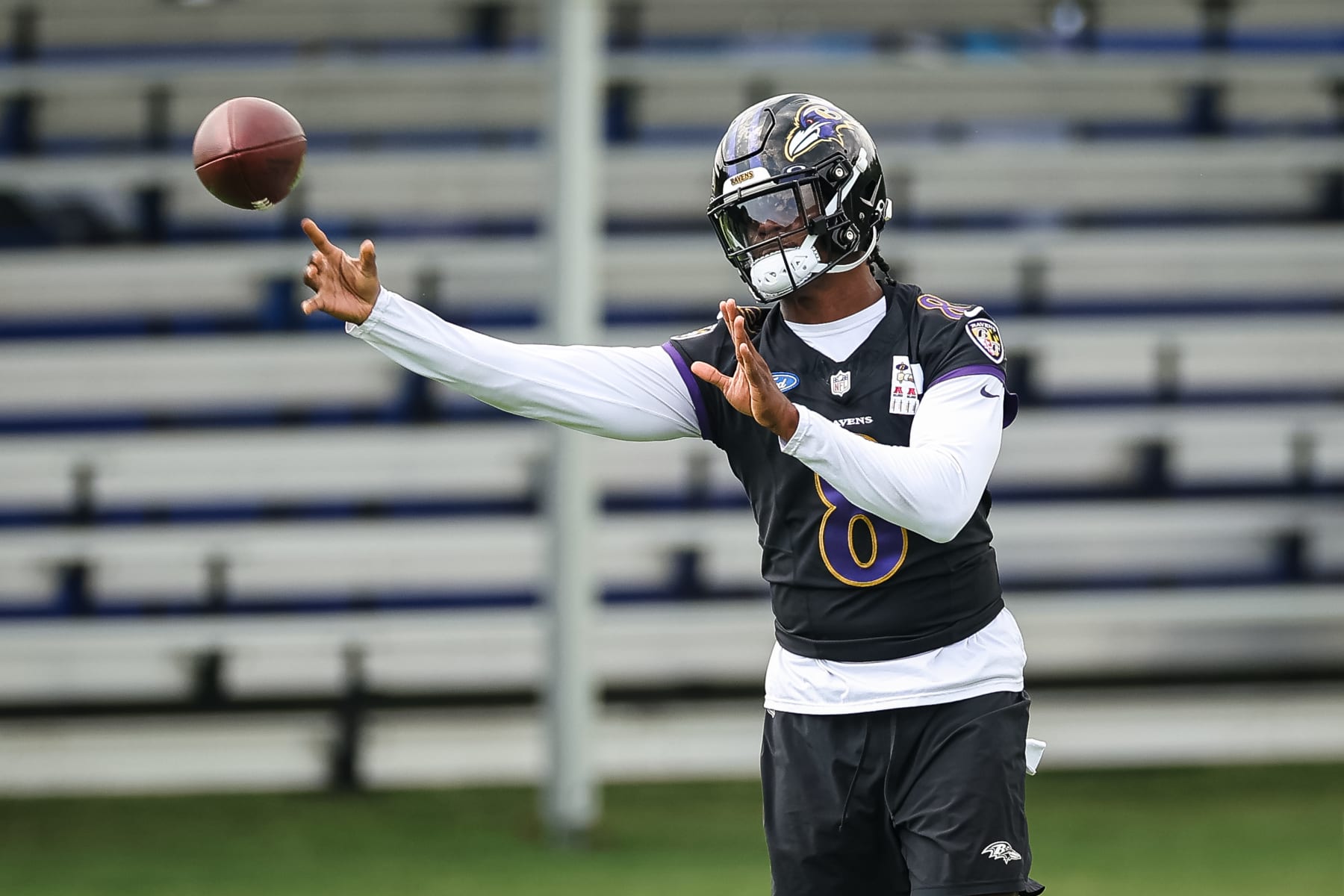 OWINGS MILLS, MD - JULY 27: Lamar Jackson #8 of the Baltimore Ravens attempts a pass during training camp at Under Armour Performance Center Baltimore Ravens on July 27, 2023 in Owings Mills, Maryland. (Photo by Scott Taetsch/Getty Images)