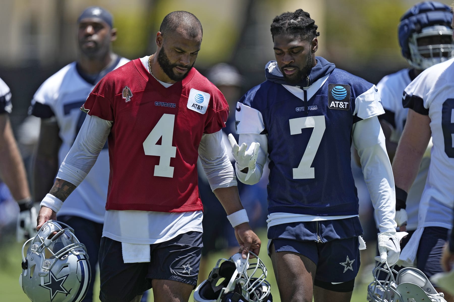 Dallas Cowboys quarterback Dak Prescott, left, and cornerback Trevon Diggs have a conversation during the NFL football team's training camp Wednesday, July 26, 2023, in Oxnard, Calif. (AP Photo/Mark J. Terrill)