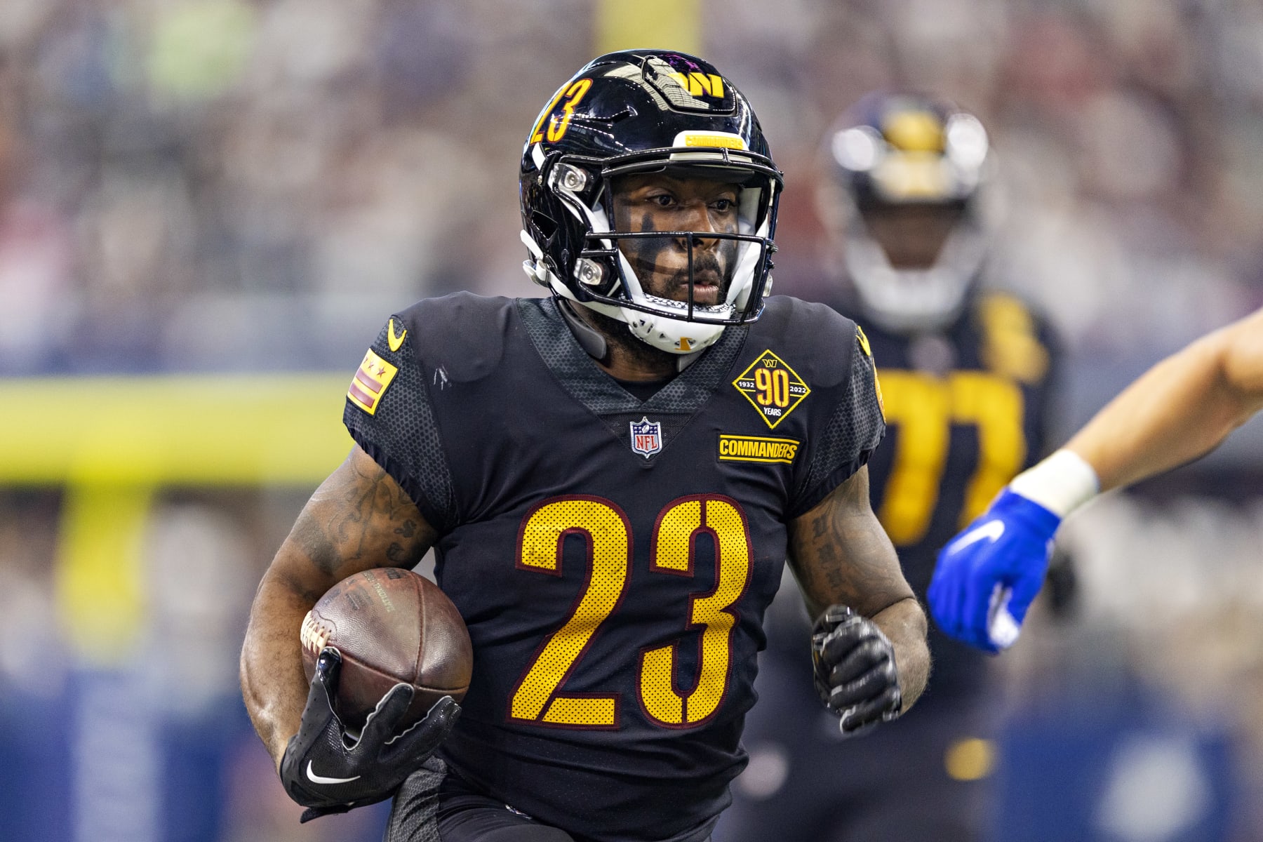 ARLINGTON, TEXAS - OCTOBER 2: J.D. McKissic #23 of the Washington Commanders runs the ball during a game against the Dallas Cowboys at AT&T Stadium on October 2, 2022 in Arlington, Texas. The Cowboys defeated the Commanders 25-10.  (Photo by Wesley Hitt/Getty Images)