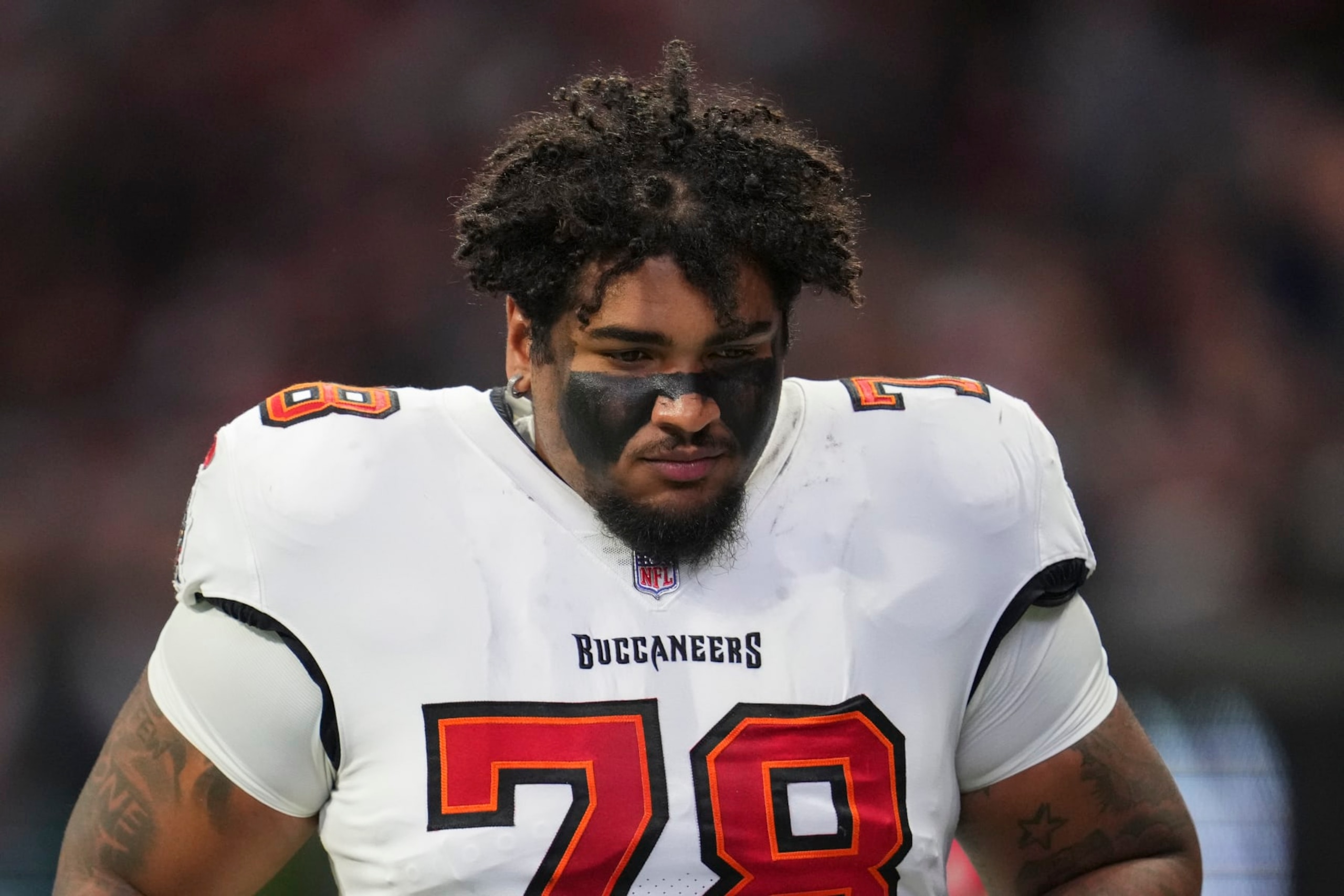 ATLANTA, GA - JANUARY 08: Tristan Wirfs #78 of the Tampa Bay Buccaneers runs off of the field against the Atlanta Falcons at Mercedes-Benz Stadium on January 8, 2023 in Atlanta, Georgia. (Photo by Cooper Neill/Getty Images)