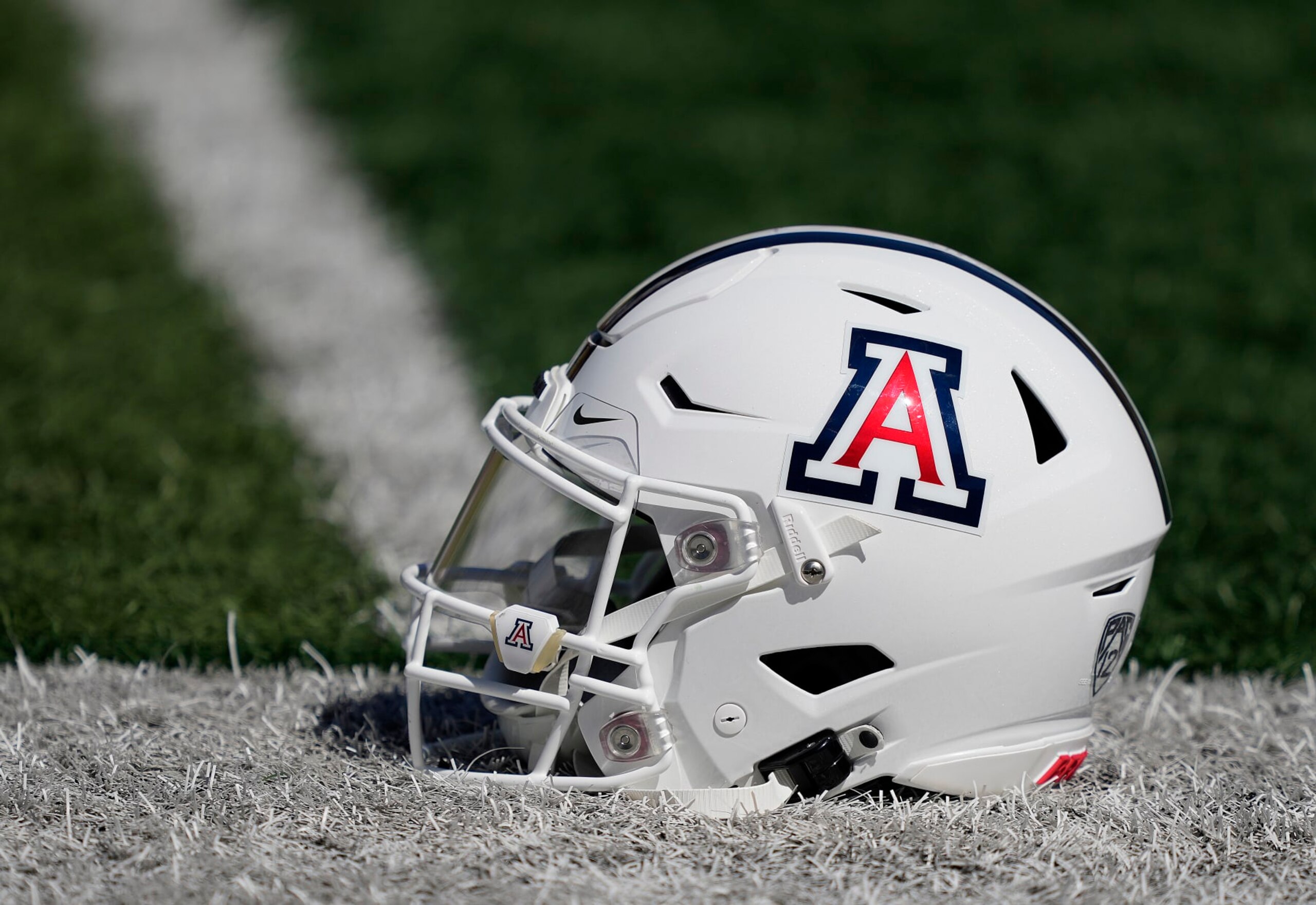 BERKELEY, CALIFORNIA - SEPTEMBER 24: A detailed view of the helmet belonging to quarterback Jayden de Laura #7 of the Arizona Wildcats sitting on the field during pregame warmups prior to play the California Golden Bears at FTX Field at California Memorial Stadium on September 24, 2022 in Berkeley, California. (Photo by Thearon W. Henderson/Getty Images)