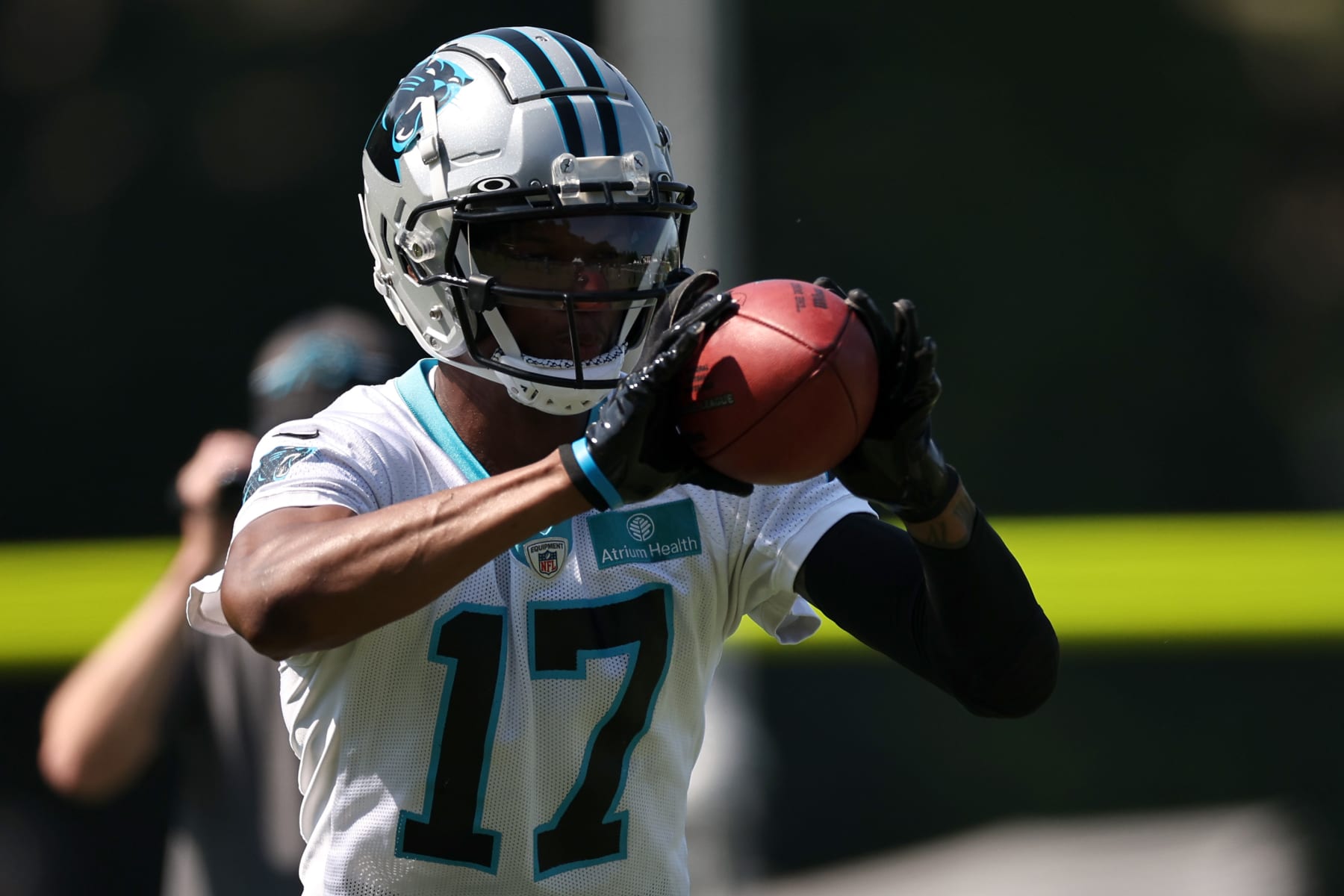 SPARTANBURG, SOUTH CAROLINA - JULY 27: DJ Chark Jr. #17 of the Carolina Panthers receives a pass during Carolina Panthers Training Camp at Wofford College on July 27, 2023 in Spartanburg, South Carolina. (Photo by Jared C. Tilton/Getty Images)