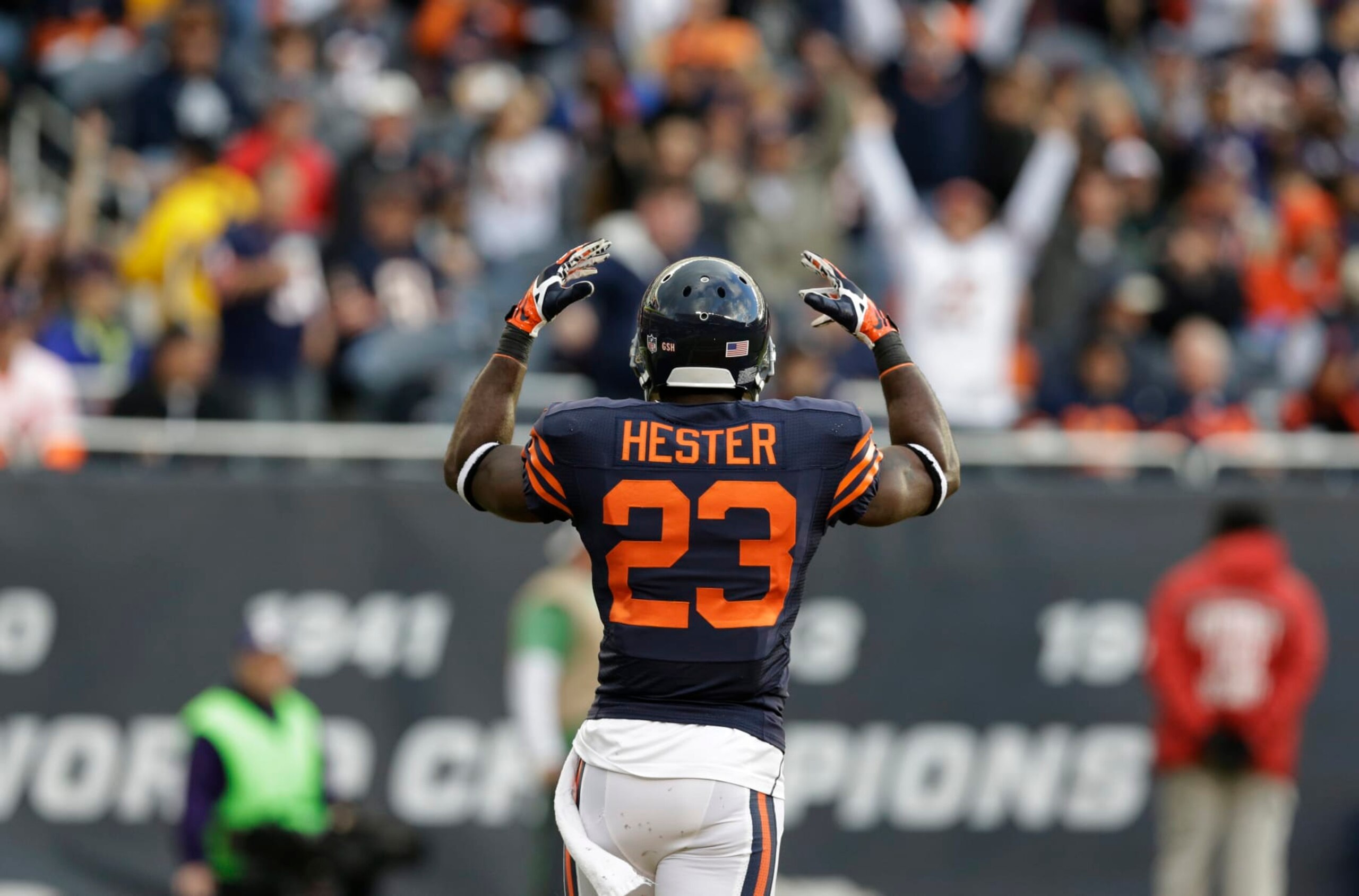 Chicago Bears wide receiver Devin Hester (23) tries to fire the crowd up during the first half of an NFL football game against the Baltimore Ravens, Sunday, Nov. 17, 2013, in Chicago. (AP Photo/Nam Y. Huh)