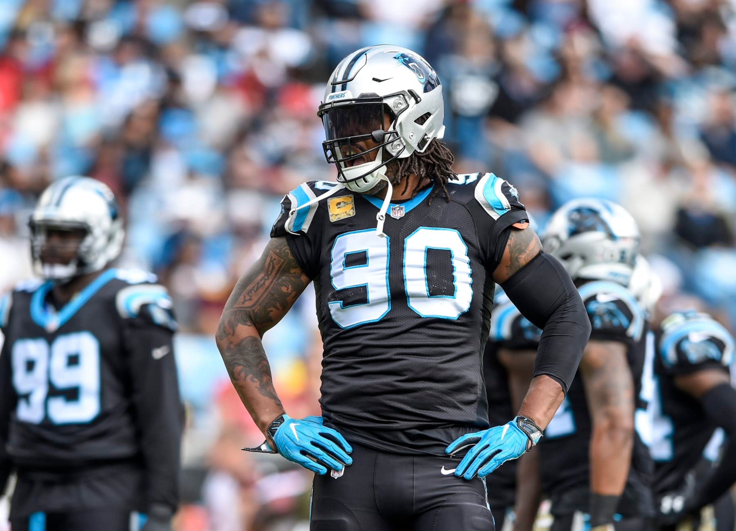 Carolina Panthers defensive end Julius Peppers (90) waits for play to resume during an NFL football game against the Tampa Bay Buccaneers in Charlotte, N.C., Sunday, Nov. 4, 2018. (AP Photo/Mike McCarn)