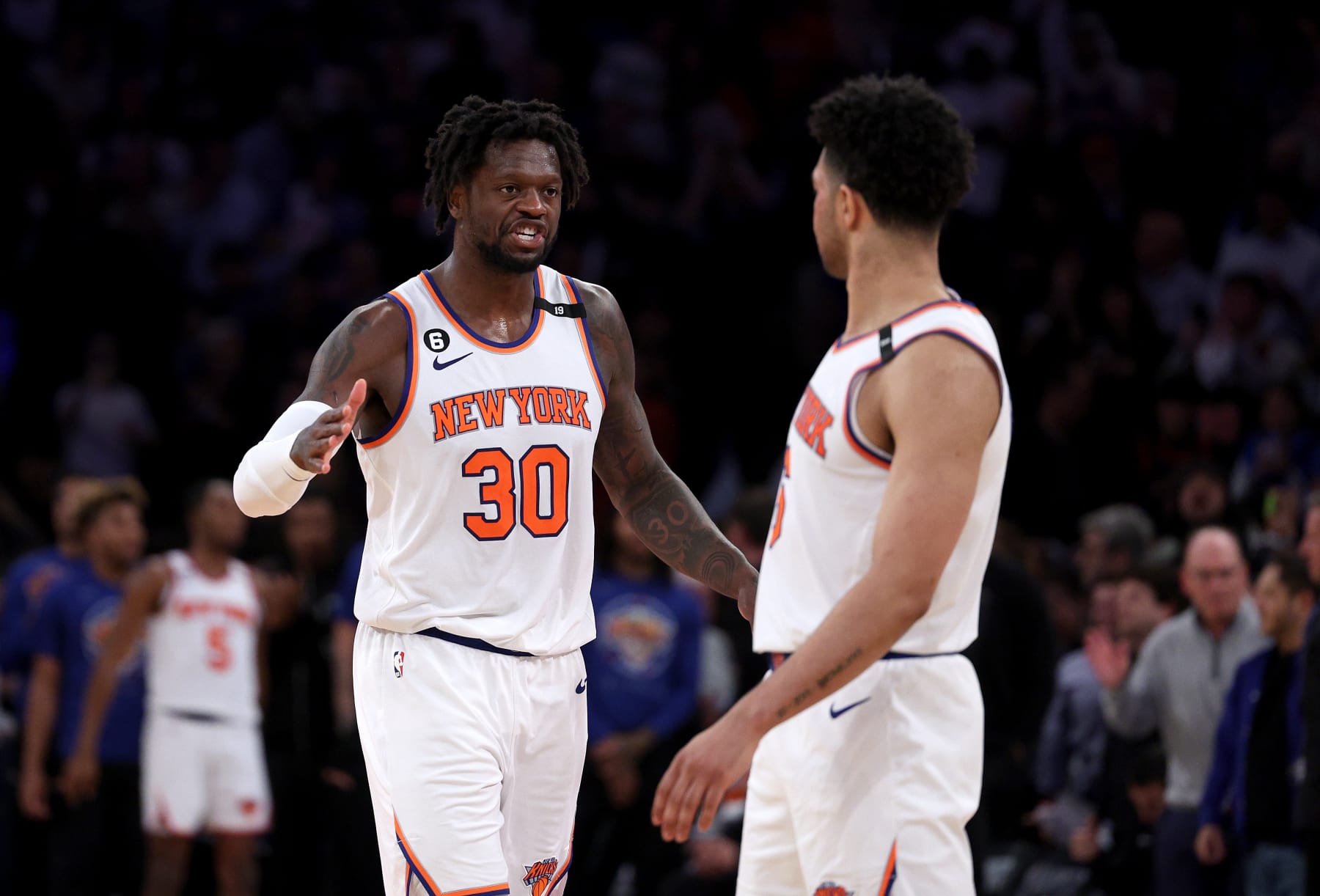 NEW YORK, NEW YORK - MAY 02:  Julius Randle #30 and Quentin Grimes #6 of the New York Knicks celebrate late in the fourth quarter during game two of the Eastern Conference Semifinals against the Miami Heat at Madison Square Garden on May 02, 2023 in New York City. The New York Knicks defeated the Miami Heat 111-105. NOTE TO USER: User expressly acknowledges and agrees that, by downloading and or using this photograph, User is consenting to the terms and conditions of the Getty Images License Agreement. (Photo by Elsa/Getty Images)