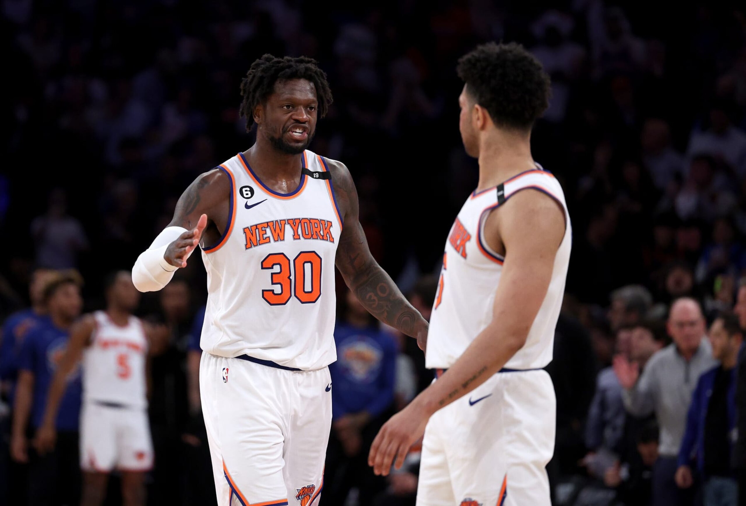 NEW YORK, NEW YORK - MAY 02:  Julius Randle #30 and Quentin Grimes #6 of the New York Knicks celebrate late in the fourth quarter during game two of the Eastern Conference Semifinals against the Miami Heat at Madison Square Garden on May 02, 2023 in New York City. The New York Knicks defeated the Miami Heat 111-105. NOTE TO USER: User expressly acknowledges and agrees that, by downloading and or using this photograph, User is consenting to the terms and conditions of the Getty Images License Agreement. (Photo by Elsa/Getty Images)