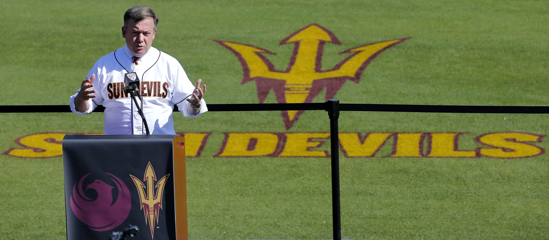 Arizona State Universty President Michael Crow formally announces, Tuesday, April 23, 2013, that Arizona State baseball will begin playing at Phoenix Municipal Stadium at the start of the 2015 season. The stadium is the current spring training home of the Oakland Athletics. (AP Photo/Matt York)