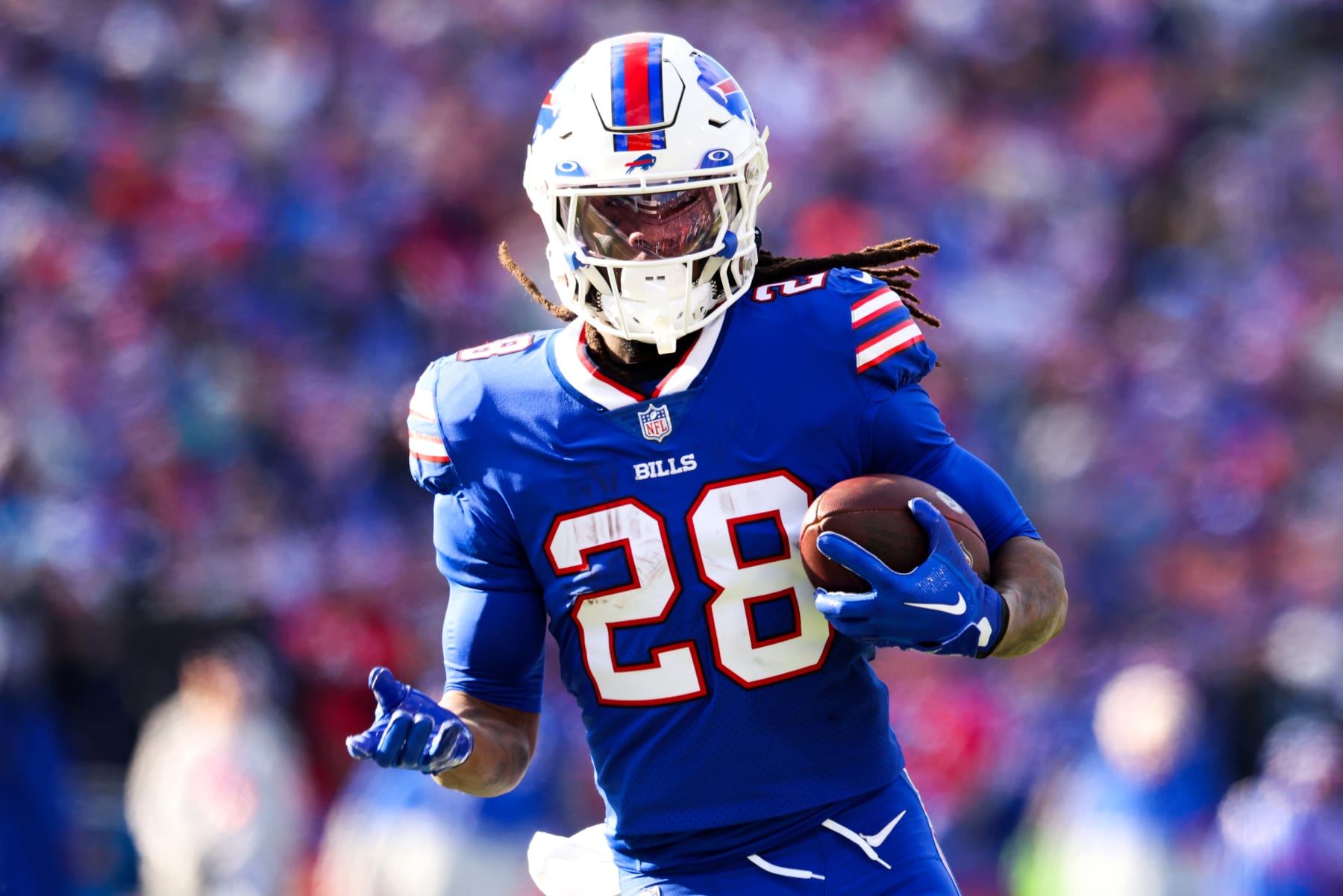 ORCHARD PARK, NEW YORK - JANUARY 15: James Cook #28 of the Buffalo Bills rushes for a touchdown against the Miami Dolphins during the first quarter of the game in the AFC Wild Card playoff game at Highmark Stadium on January 15, 2023 in Orchard Park, New York. (Photo by Bryan M. Bennett/Getty Images)