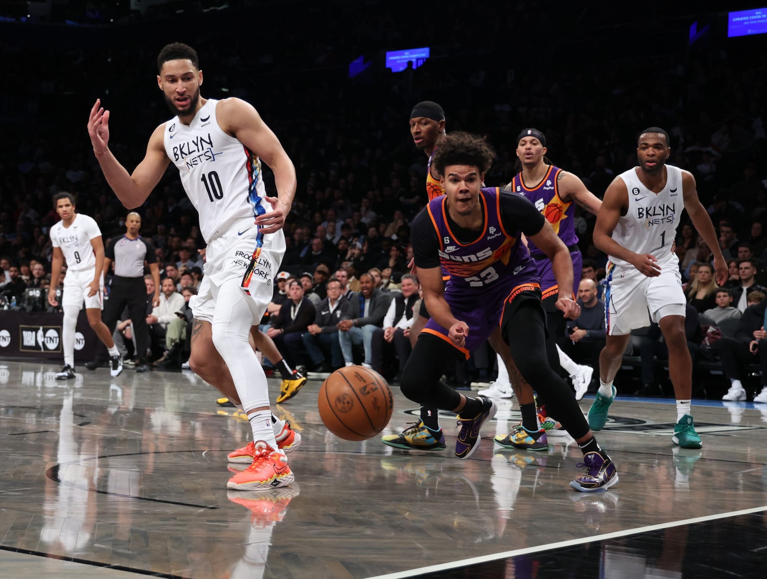 NEW YORK, NEW YORK - FEBRUARY 07:  Ben Simmons #10 of the Brooklyn Nets loses the ball against Cameron Johnson #23 of the Phoenix Suns during their game at Barclays Center on February 07, 2023 in New York City.    User expressly acknowledges and agrees that, by downloading and or using this photograph, User is consenting to the terms and conditions of the Getty Images License Agreement.  (Photo by Al Bello/Getty Images)
